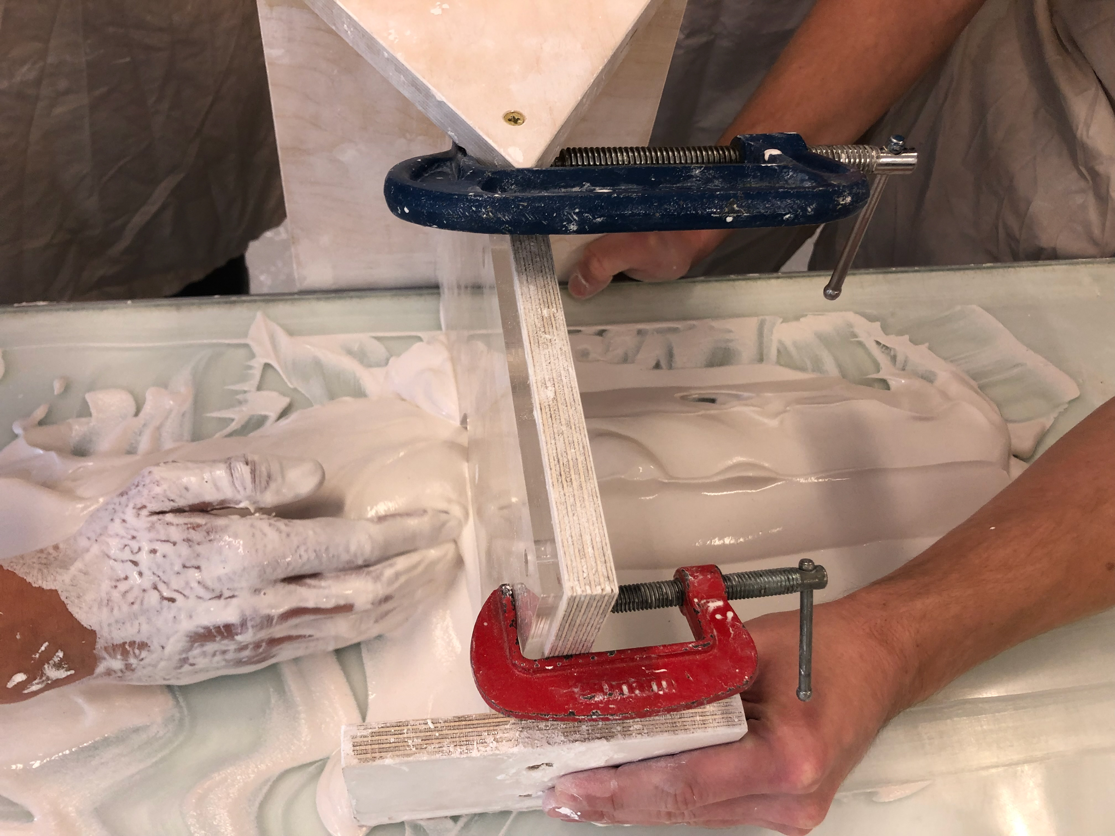 The sledging tool is push into the plaster to create the shape/