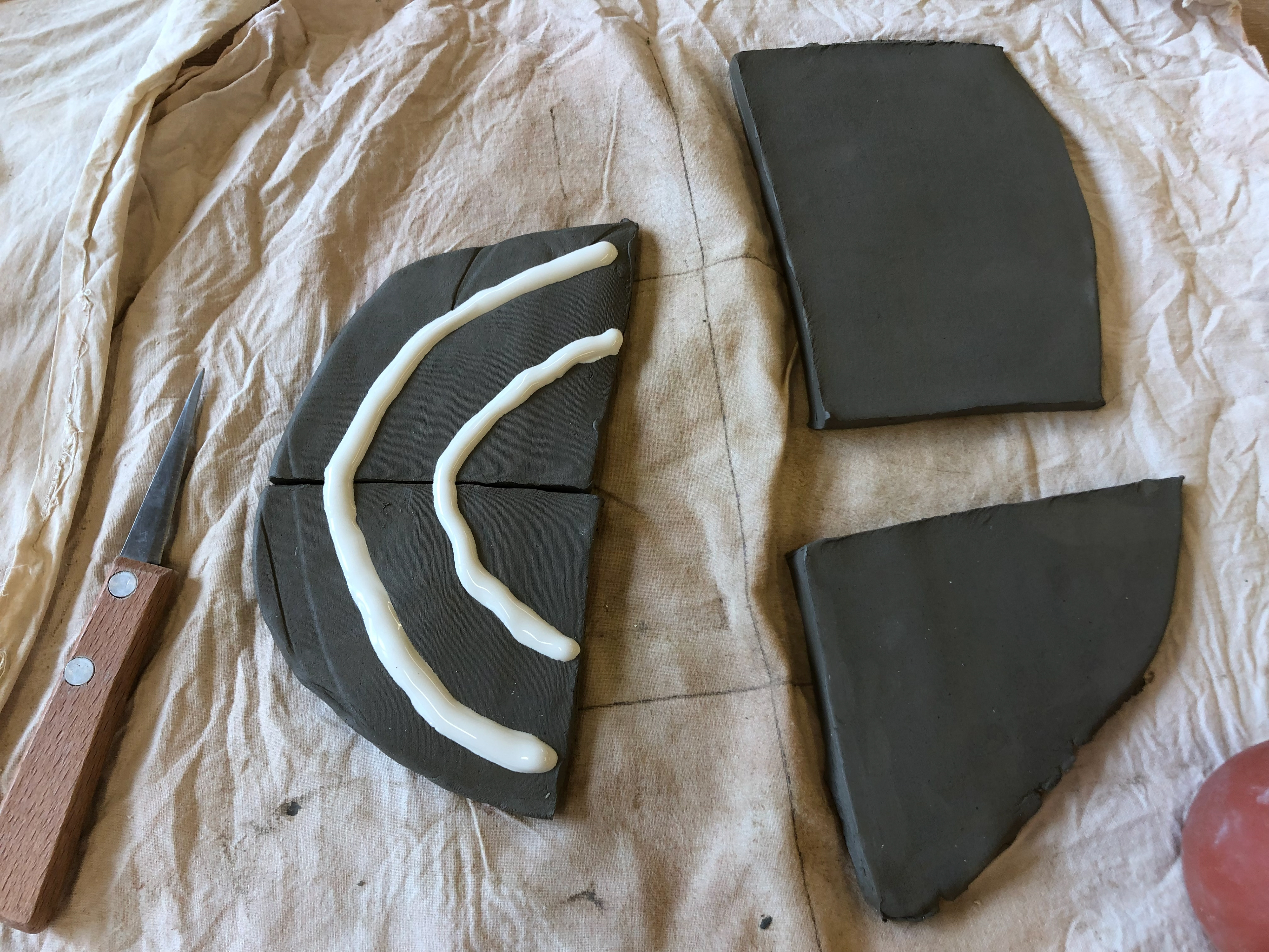 Slip on fresh moist clay
