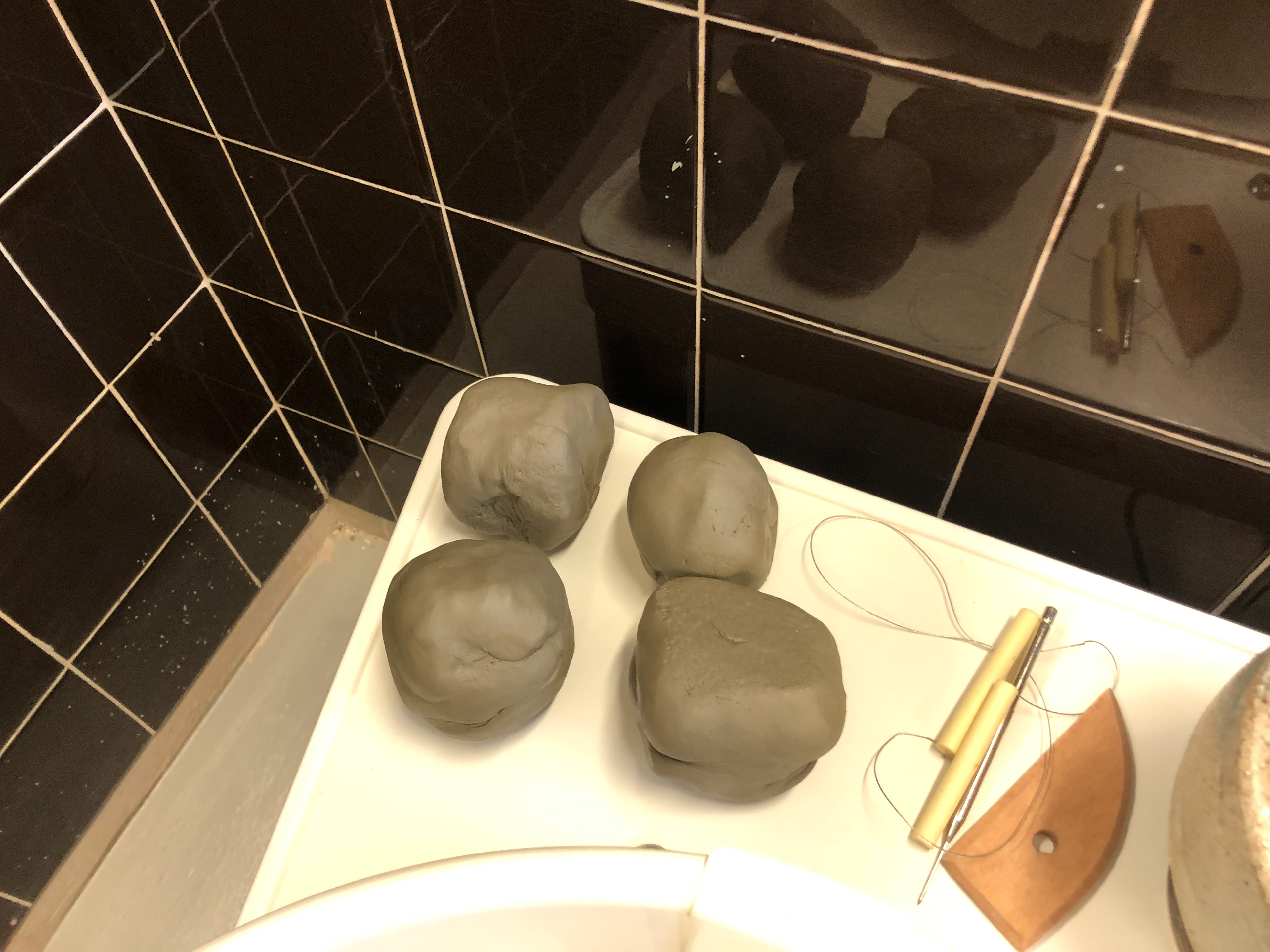 Starting four balls of clay.