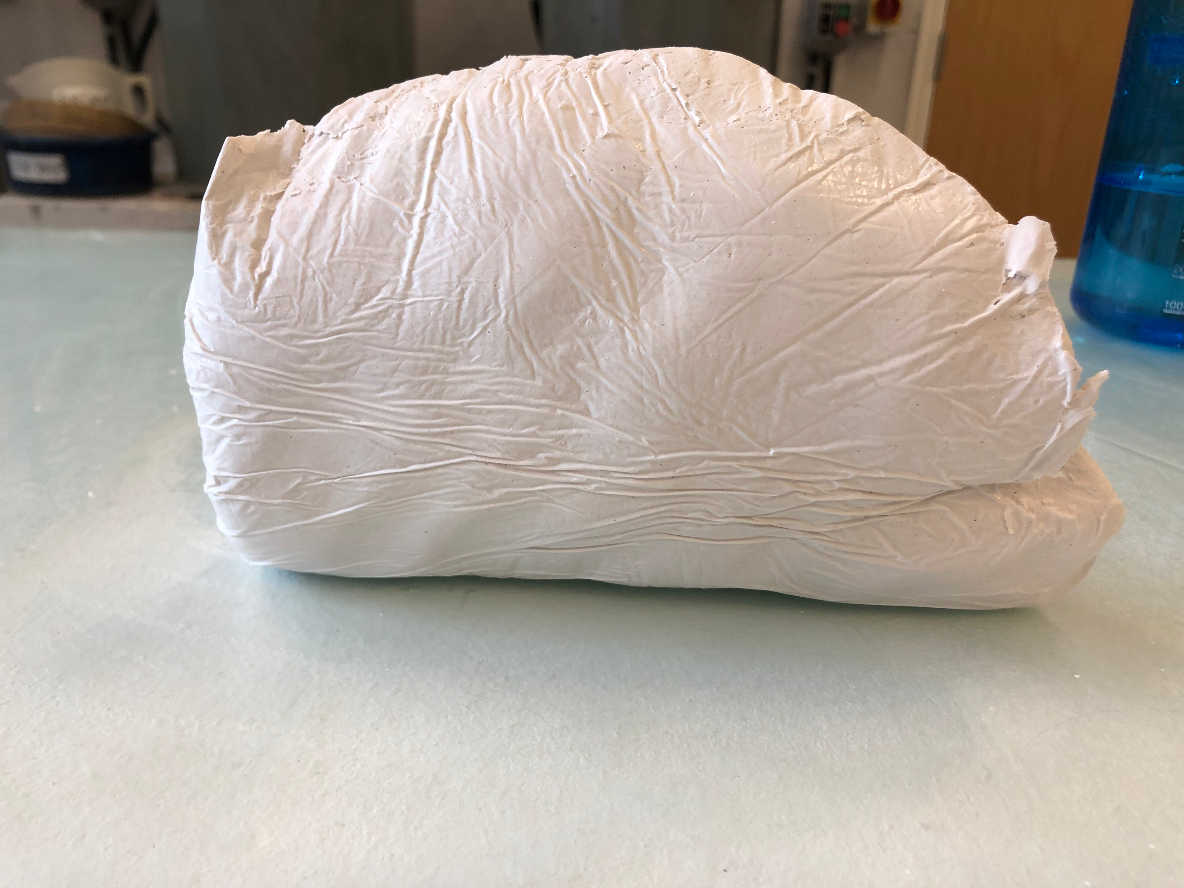 Smaller creases from the plastic.
