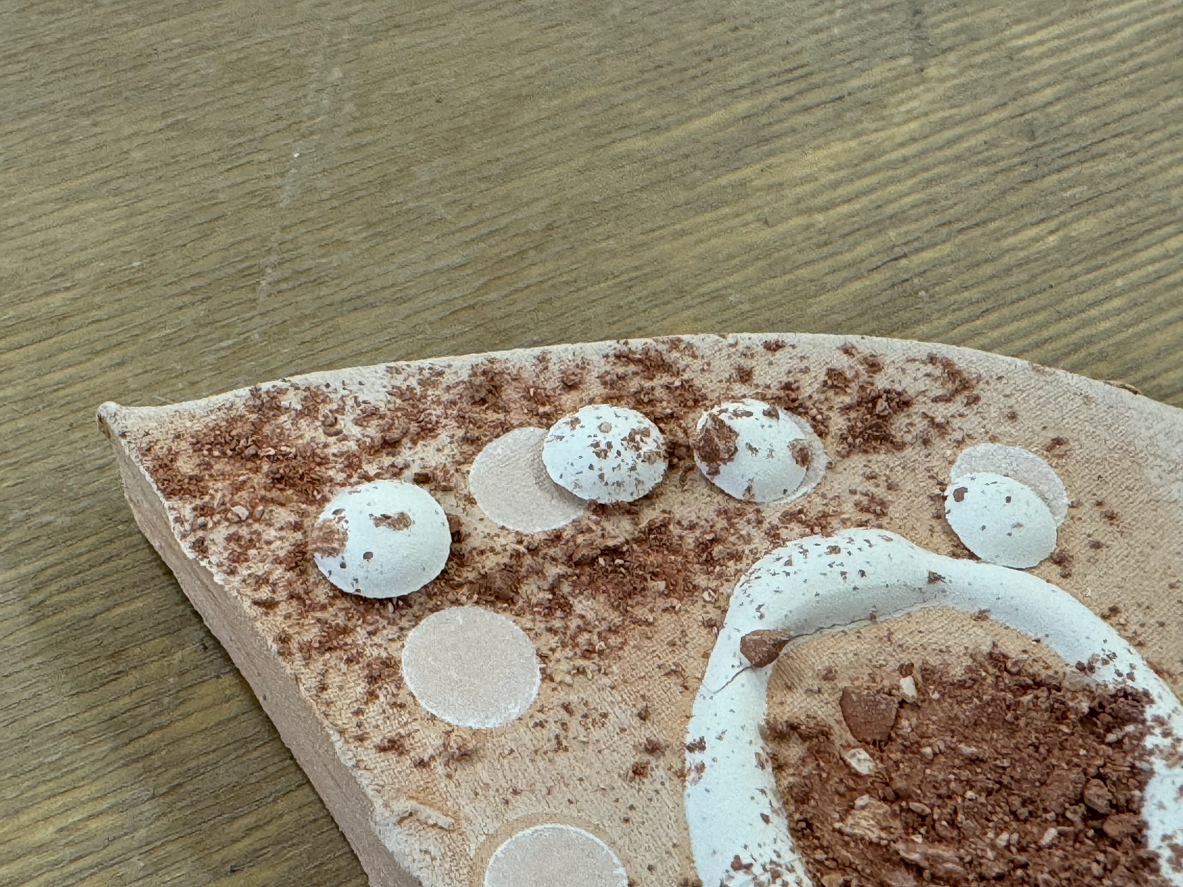 More issues with the dried slip coming off the fired pieces.