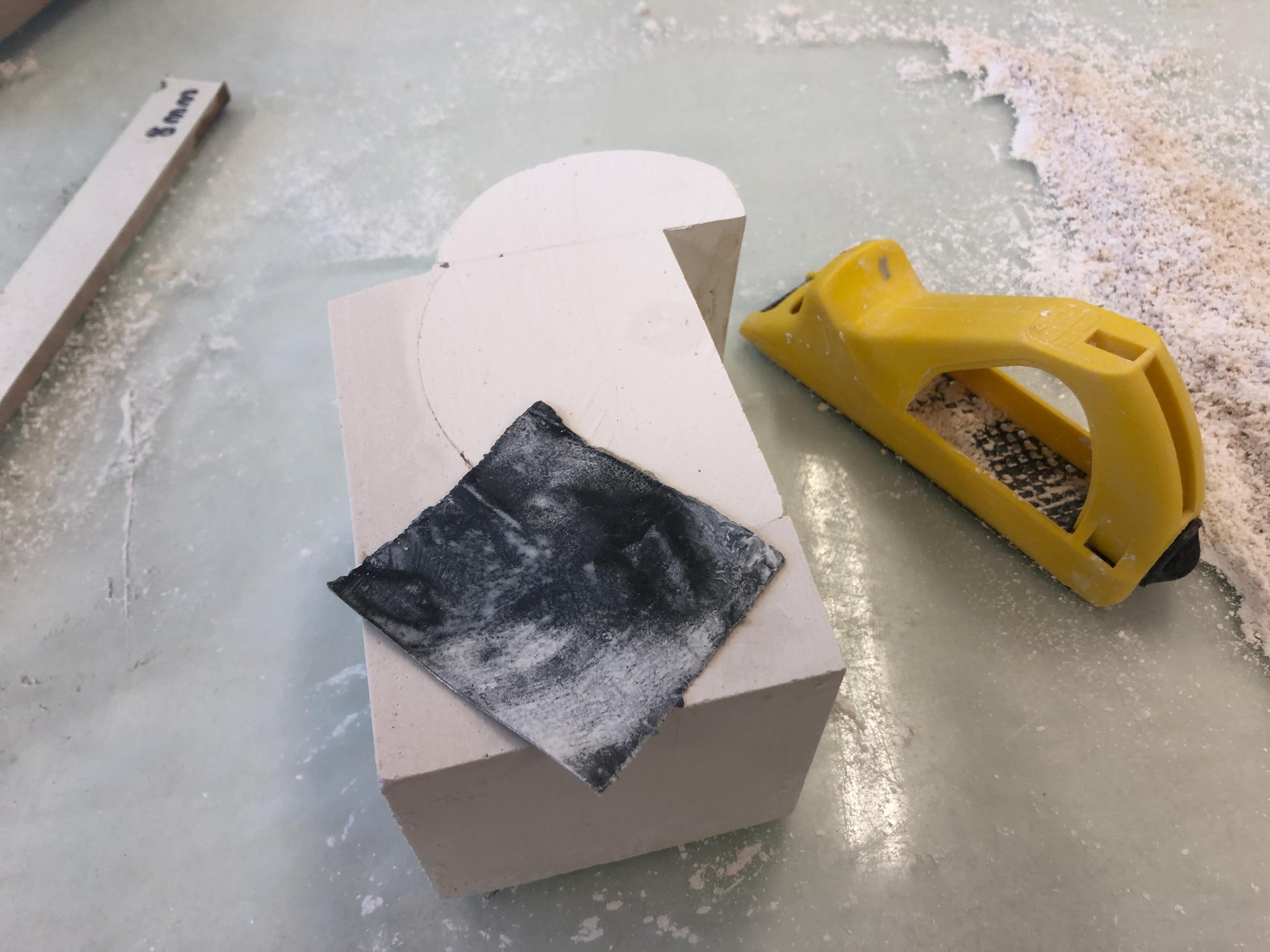 Sanding down the first pour.