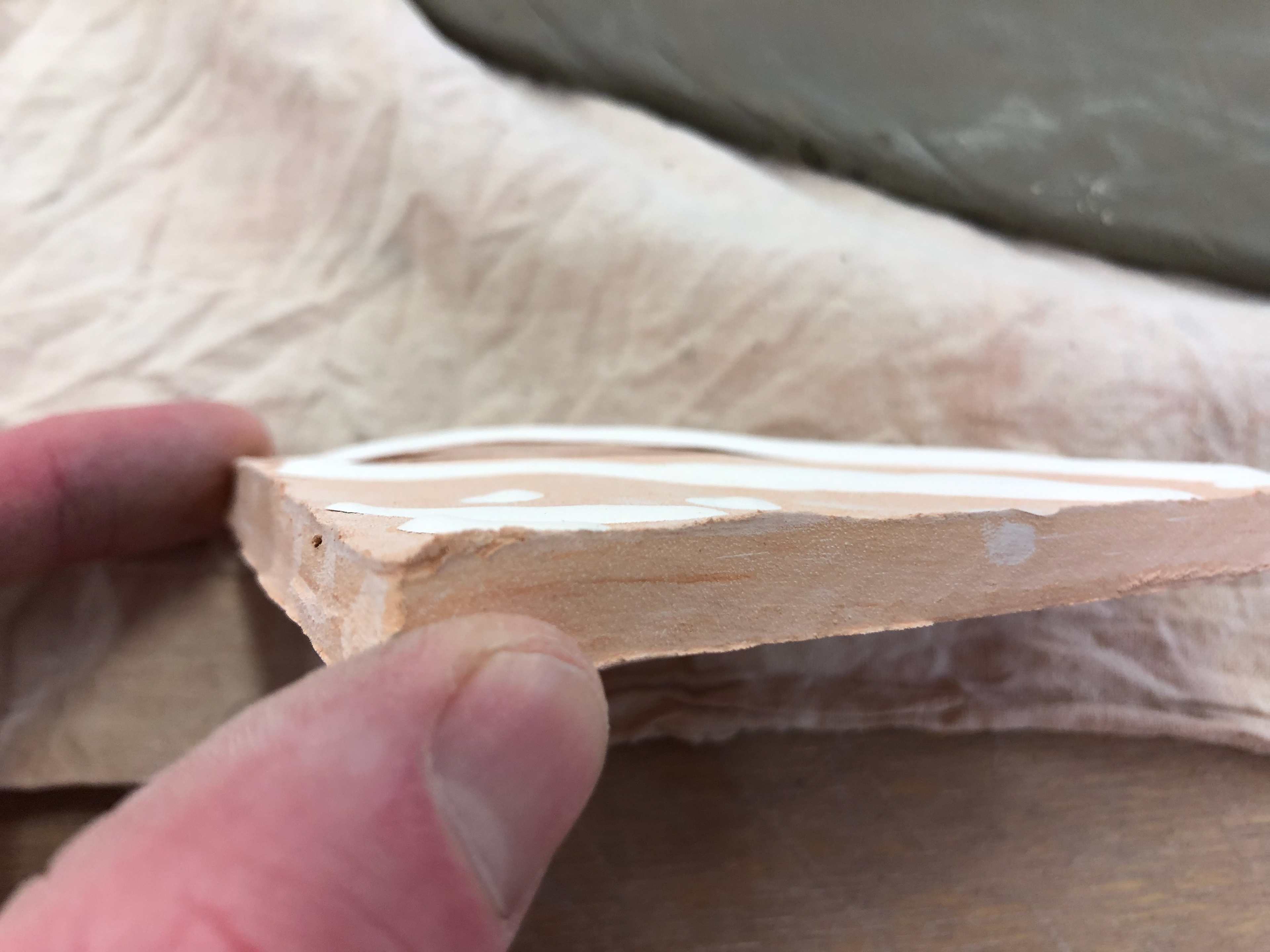 The slip after it comes out of the kiln, elevated from the clay.