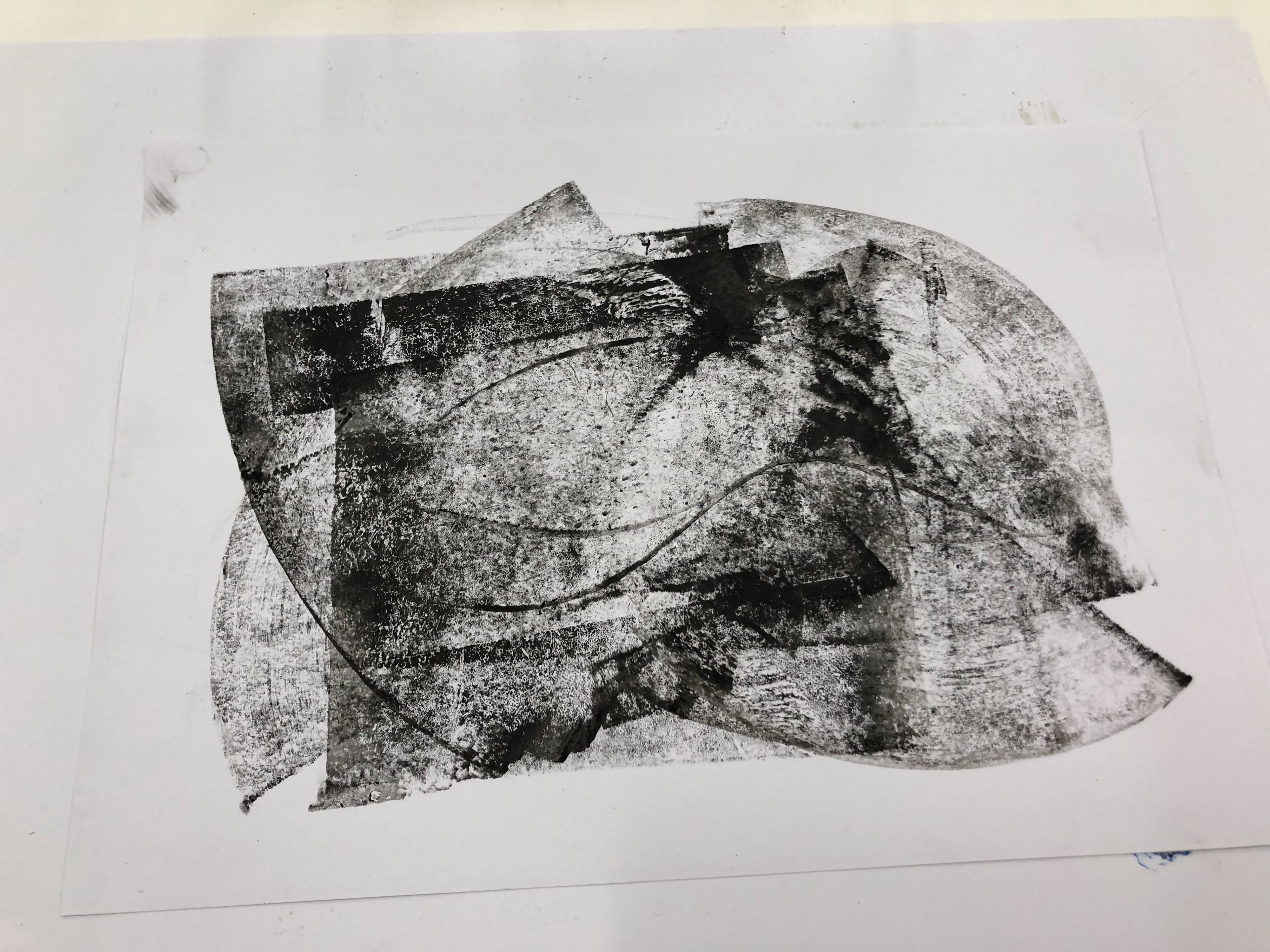 I placed the paper over the metal to roll over it with a roller and ink.