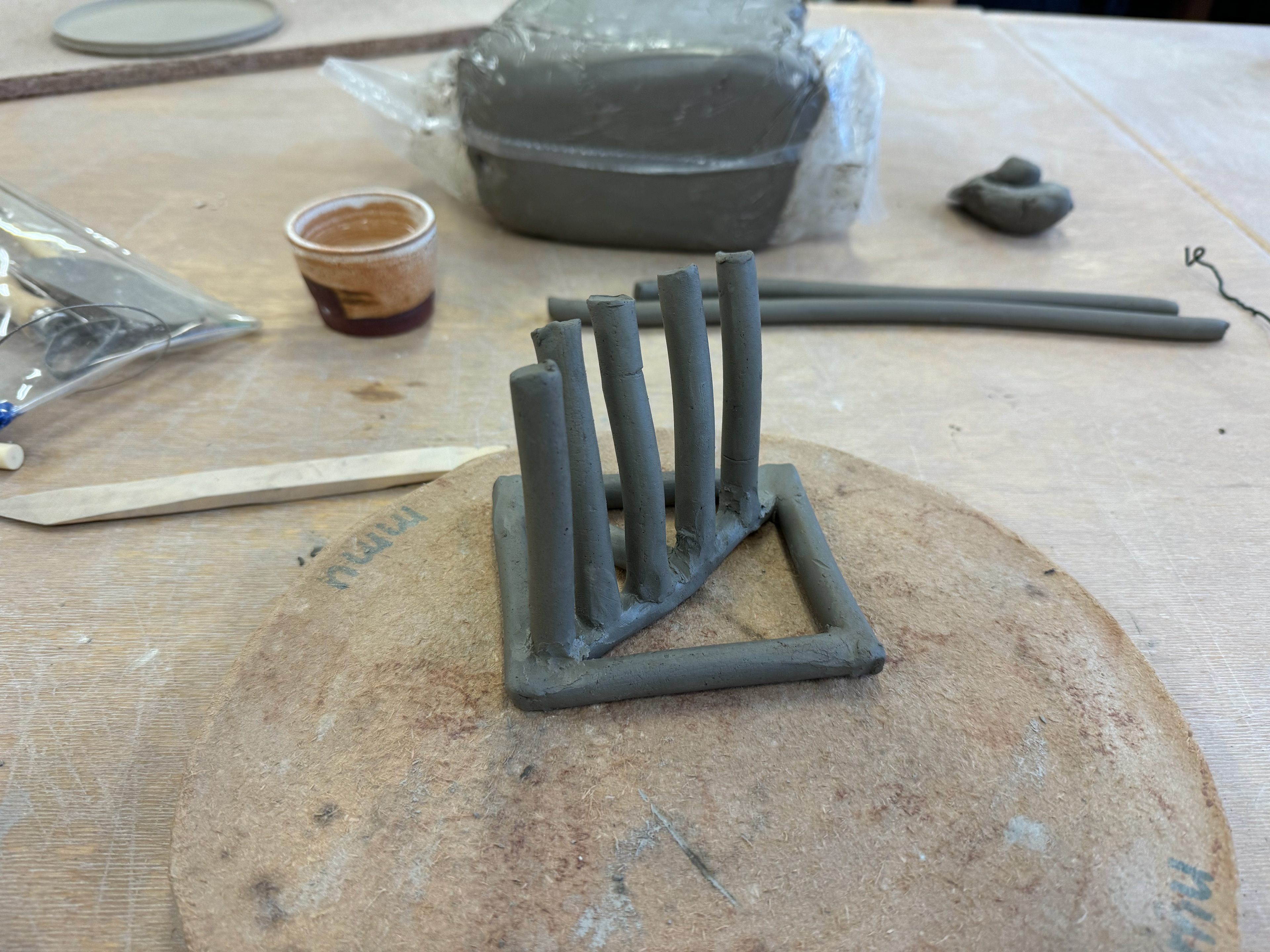 Base with finger stacks leaning over and needing support