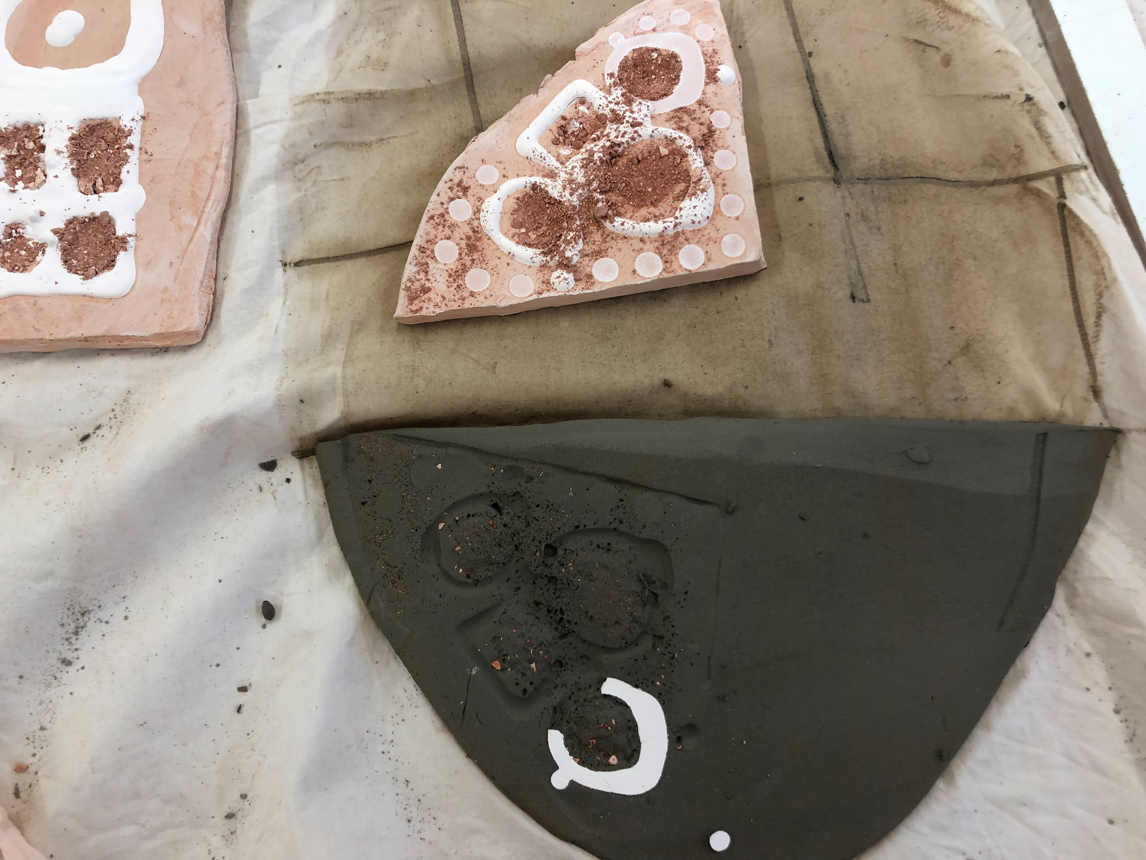 Imprint of crushed clay and slip creates a great texture but doesn't particularly fit where I want to take this project.