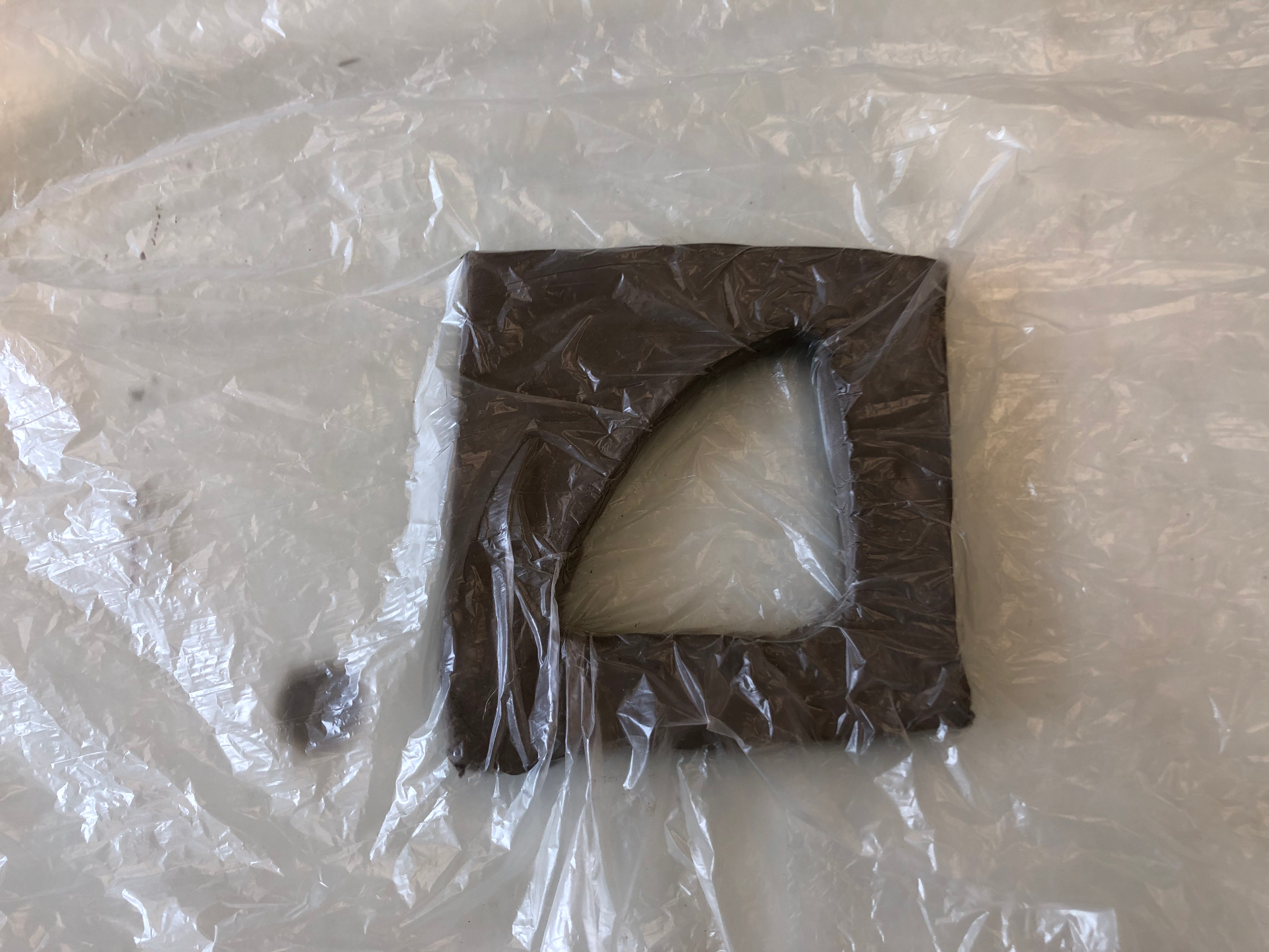 Putting plastic in the hole.