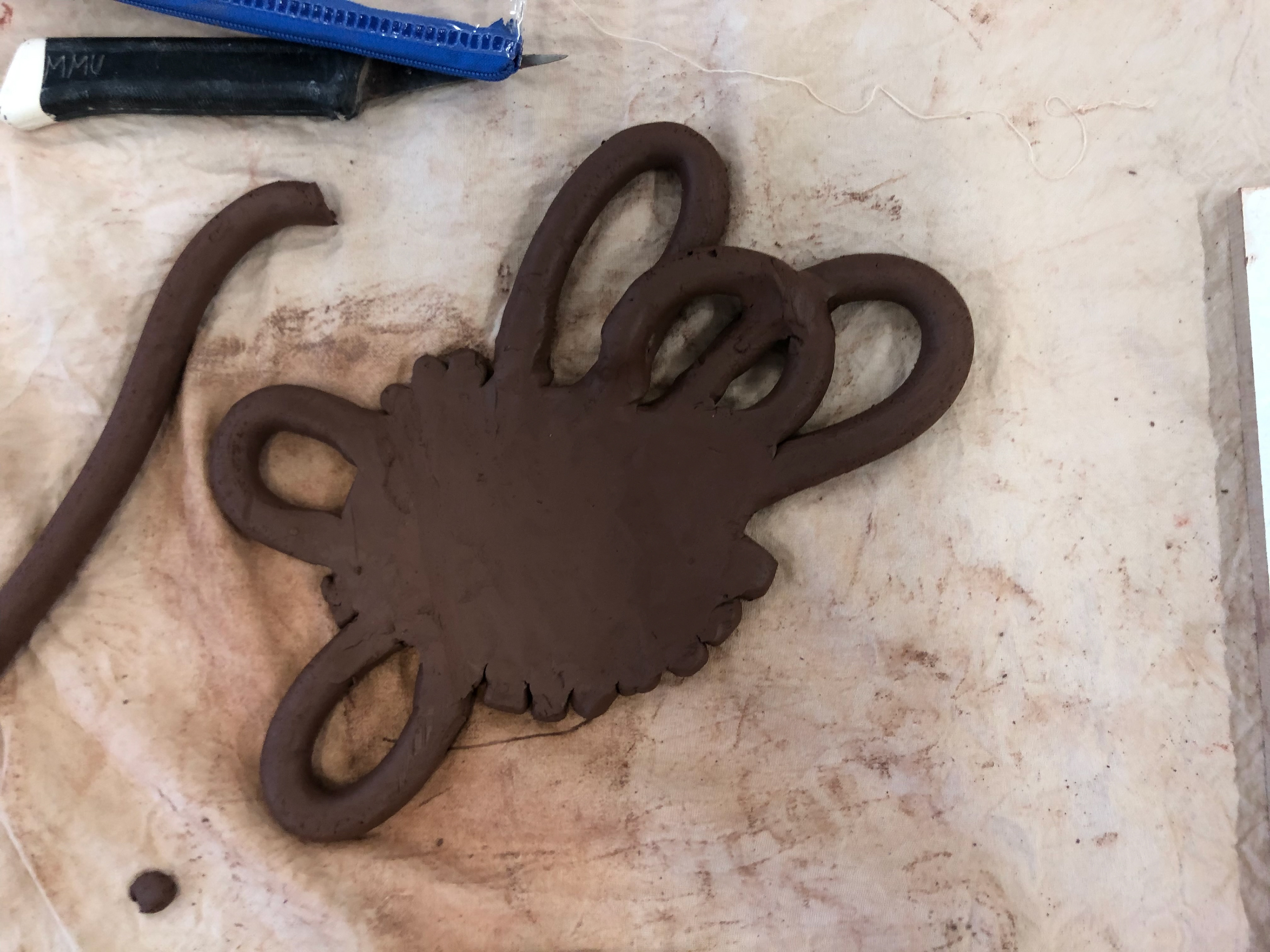 Overlaying the rolls of clay