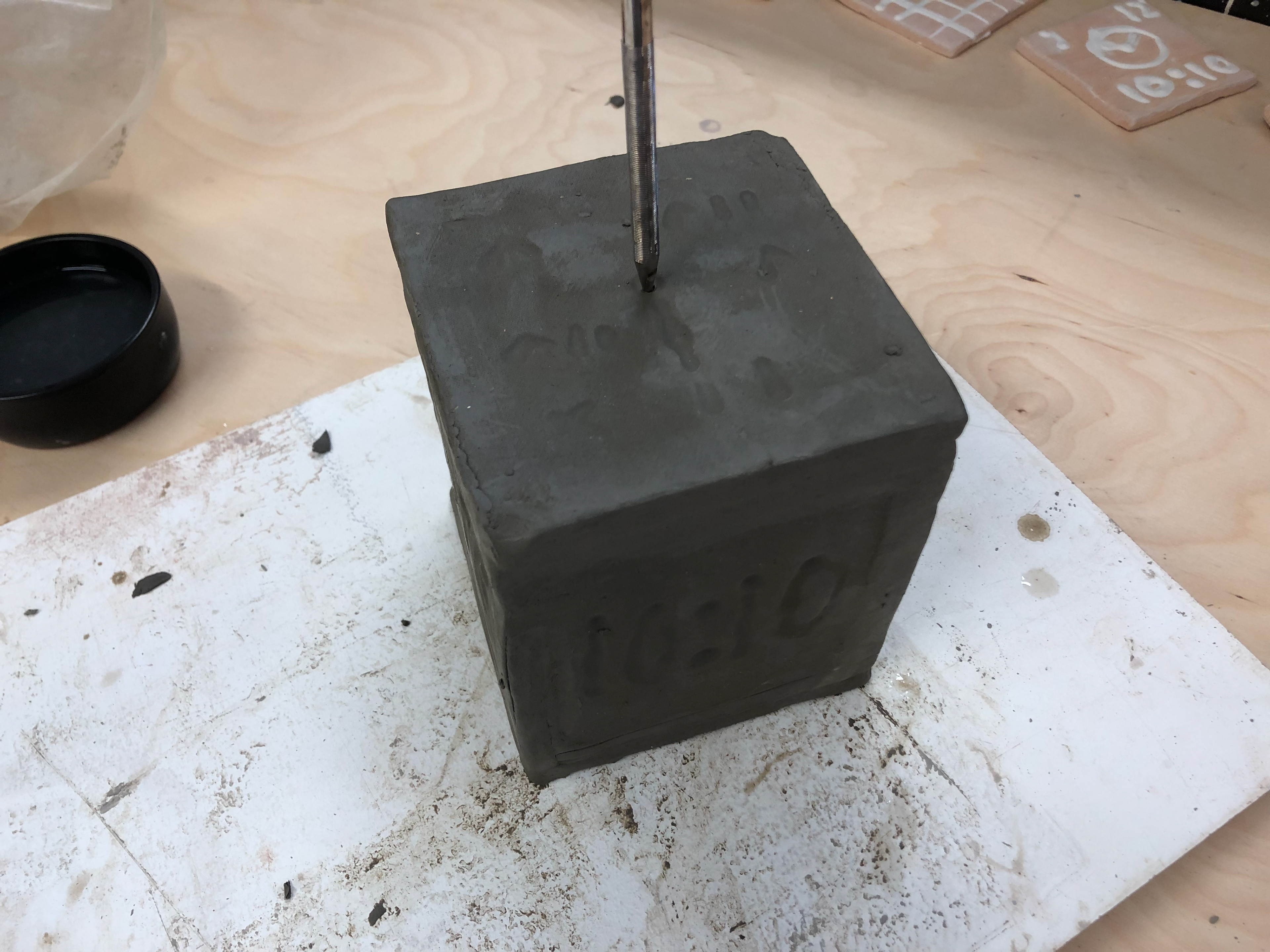 Putting a small hole in so the pressure doesn't cause the cube to explode in the kink.