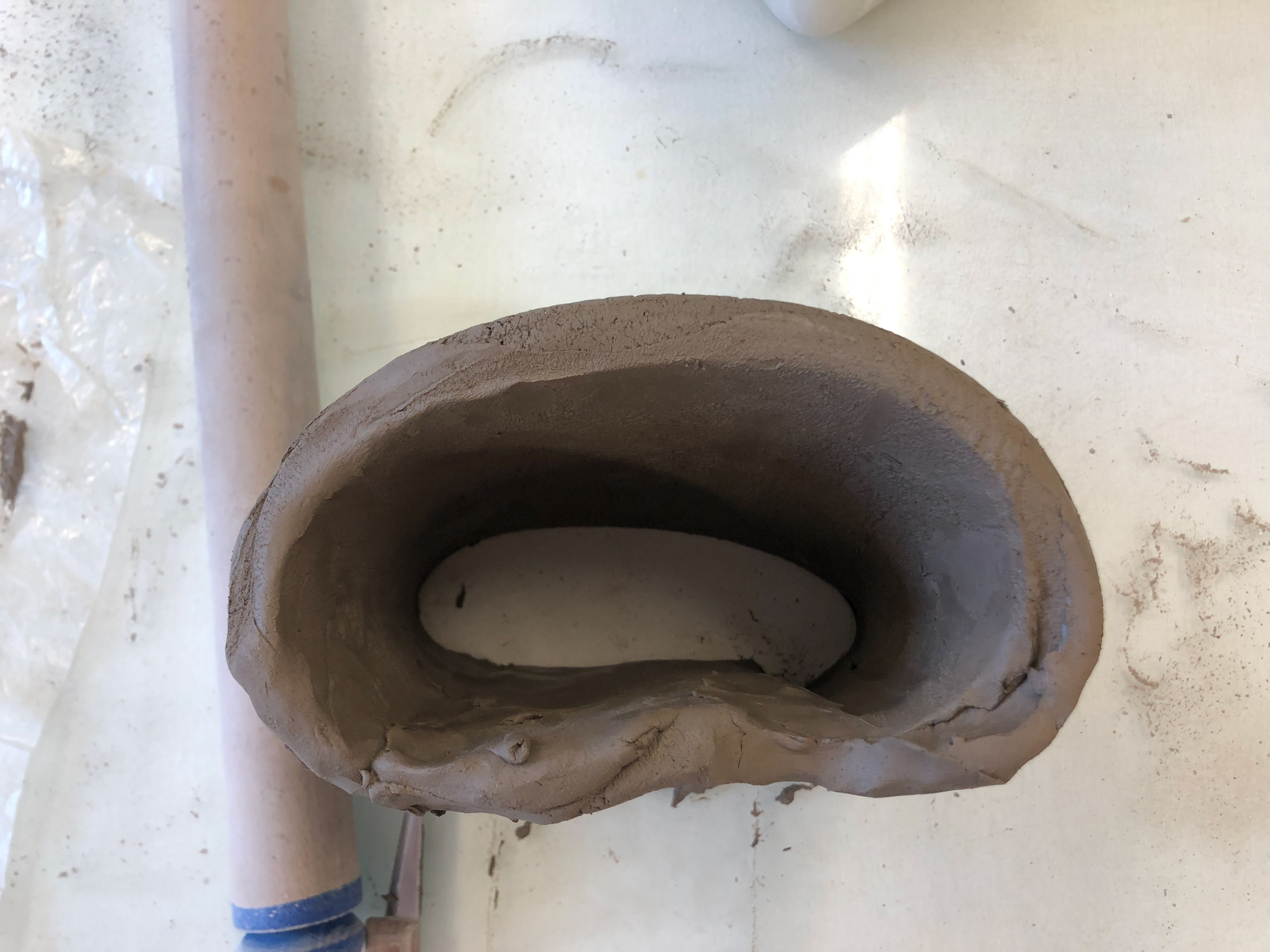 Clay mould with soft soaped plaster design.
