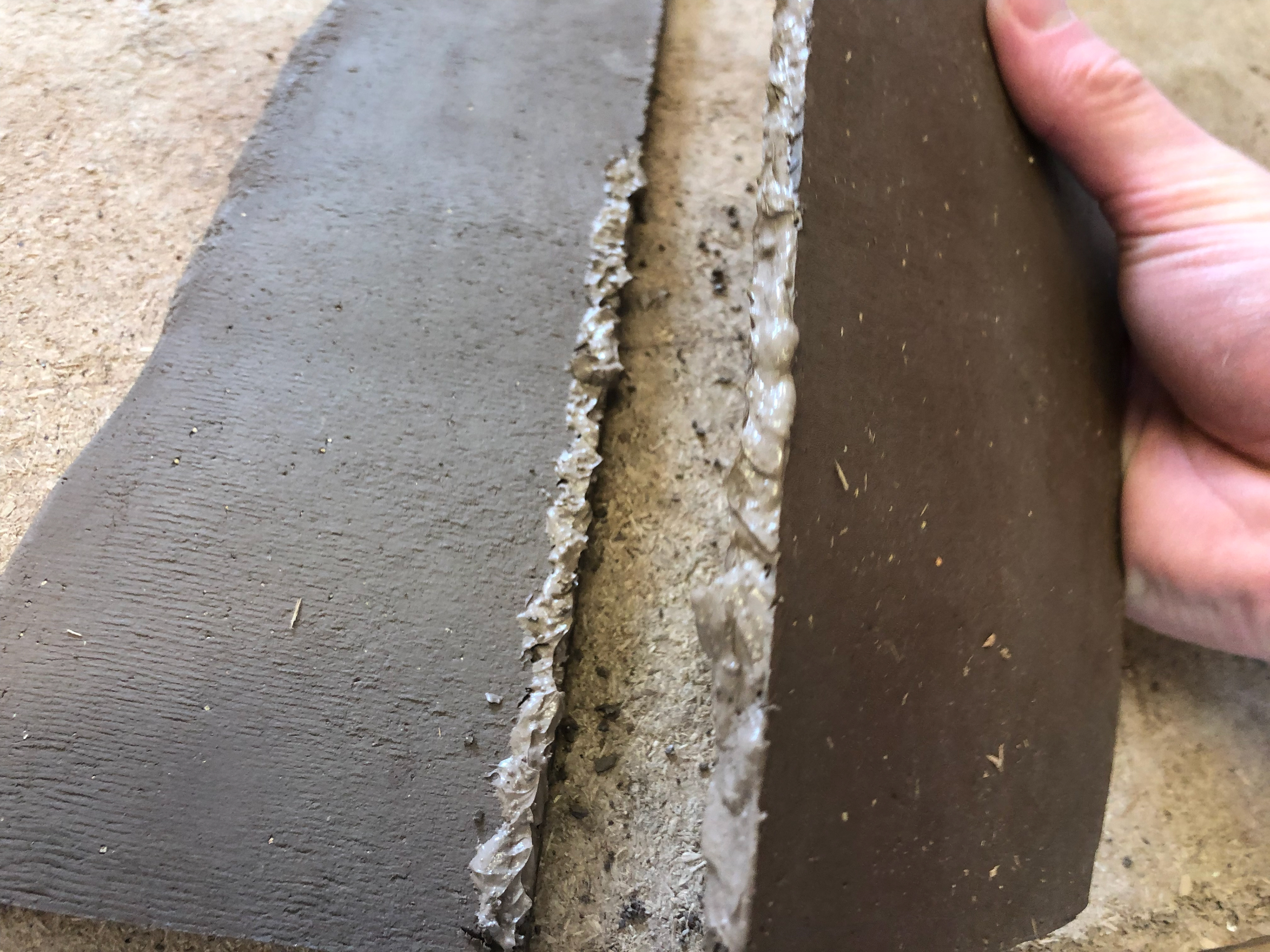 Slip-like clay to bind the two parts together