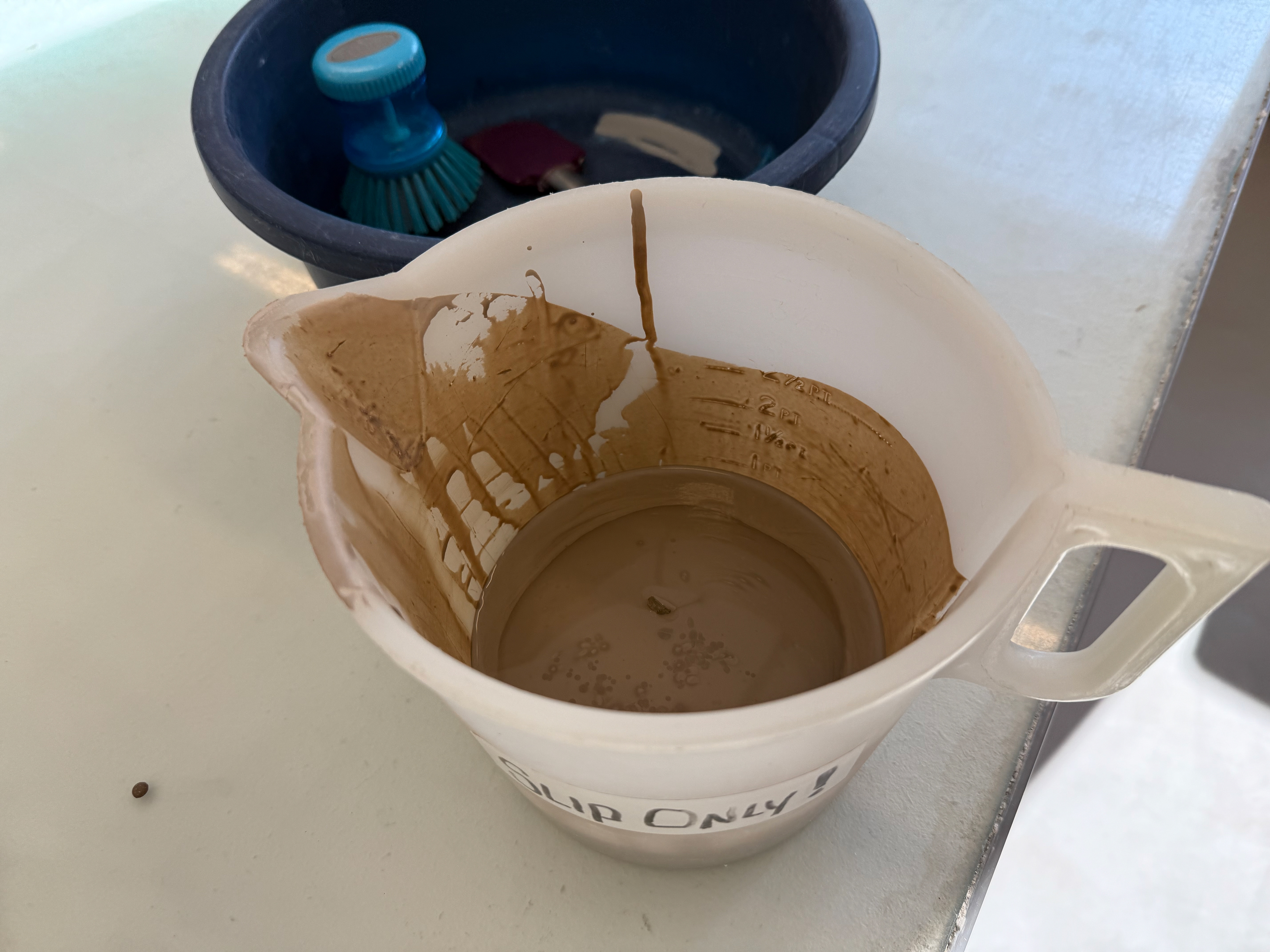 The remaining slip for inside the mould.