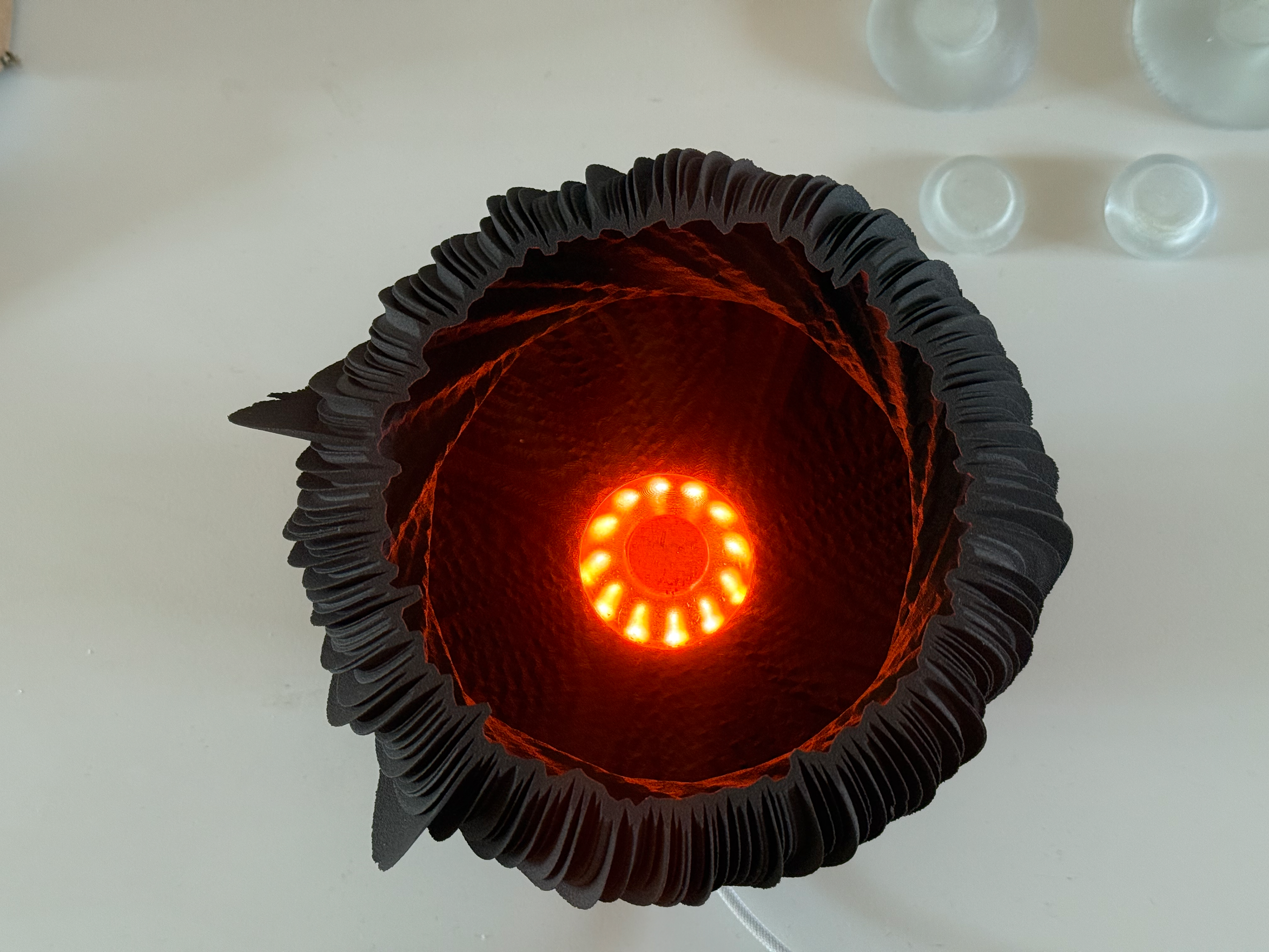 Lit up looks interesting but I don't think it works as well as the PETG prints. Maybe frosting the resin would work.