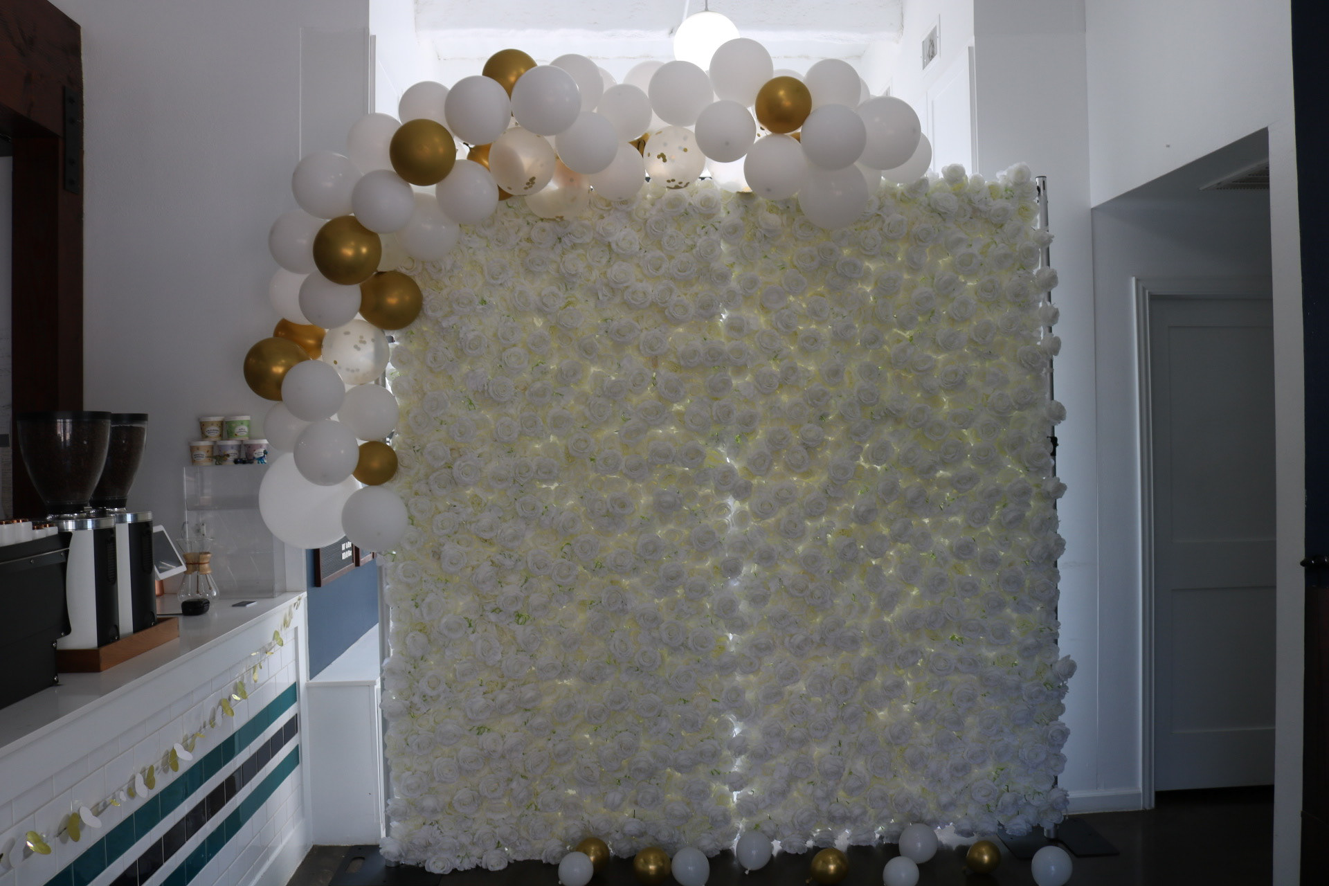 flower wall and balloon arch