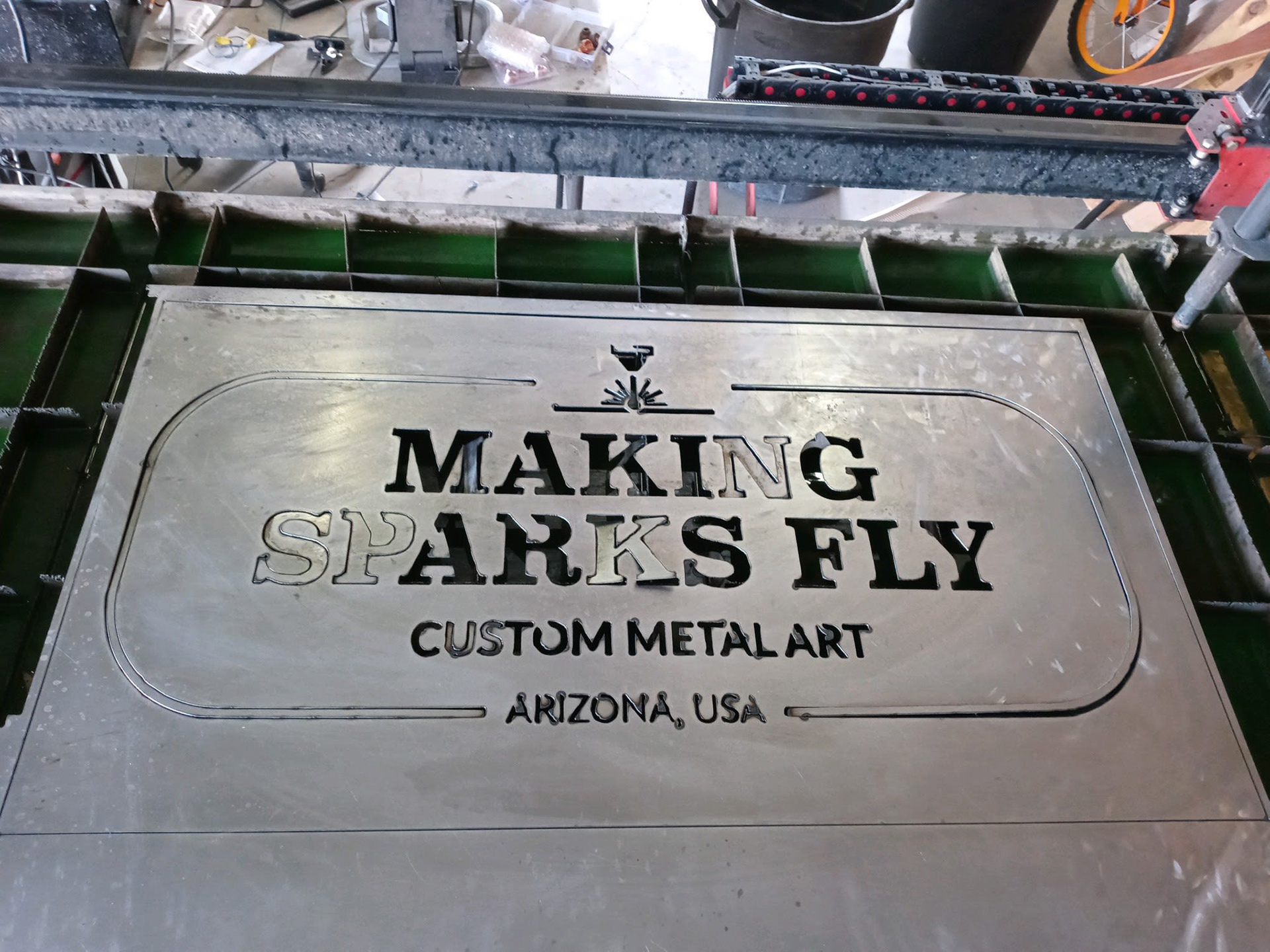 In-progress metal sign.