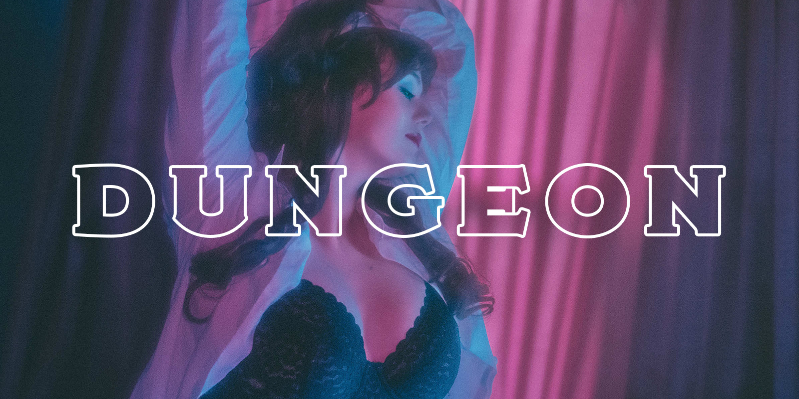 Countess Cecilia seductively posing in her BDSM dungeon where she offers dominatrix services in Cincinnati, Ohio