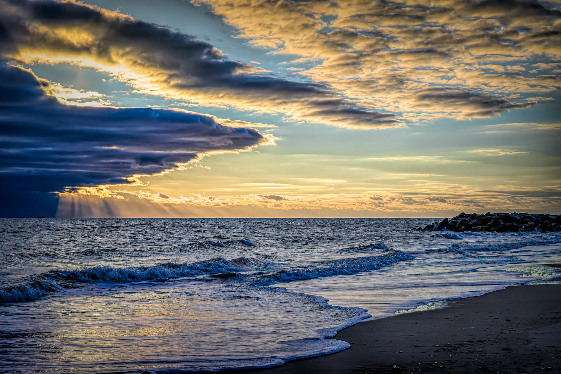 Clouds, sunbeams, and water