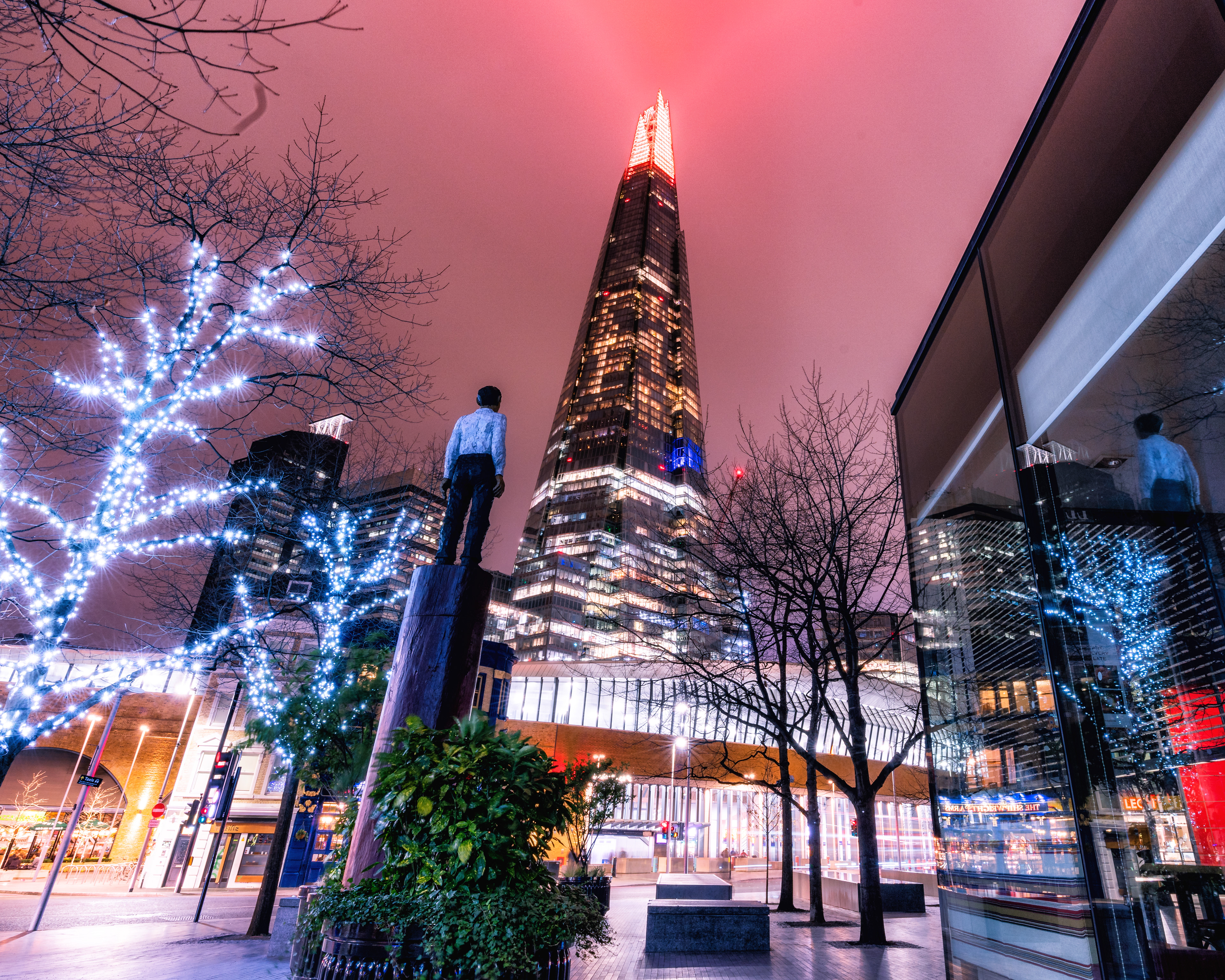 Stephen Balkenhol’s Sculpture seemingly staring at the Shard