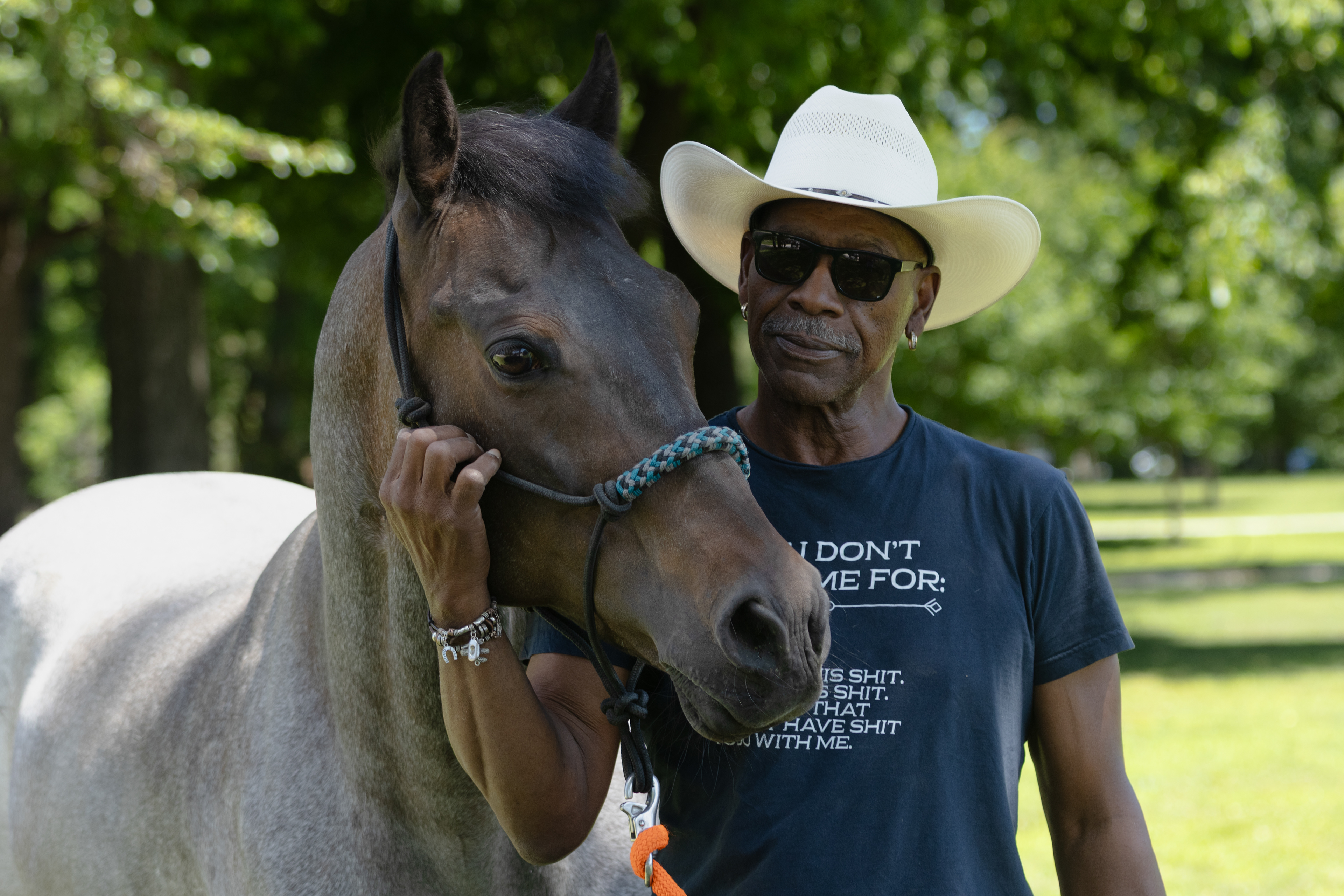 Greg Hollywood Adrow stands with his horse Big Blue at Washington Park in Chicago on Friday, June 19, 2026. Adrow said riding a horse is like being "seven feet closer to God." | Kieran Stover/Sun-Times
