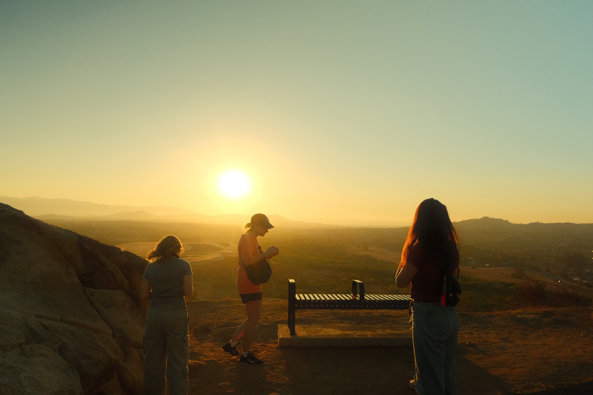 Students taking photos of the sunset at the top of Mt. Rubidoux