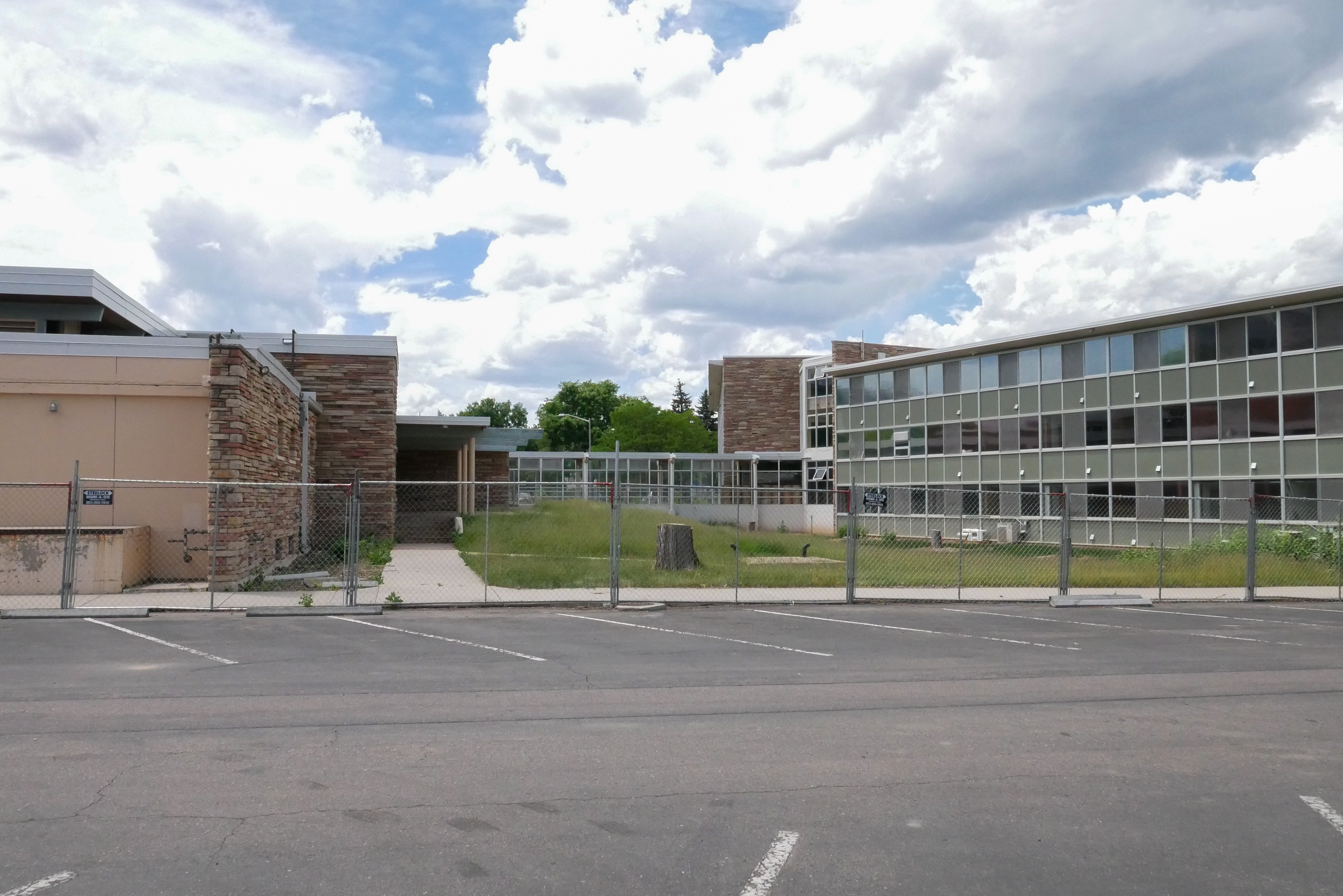 Fences surround the east-facing side of the northern half of the dormitory