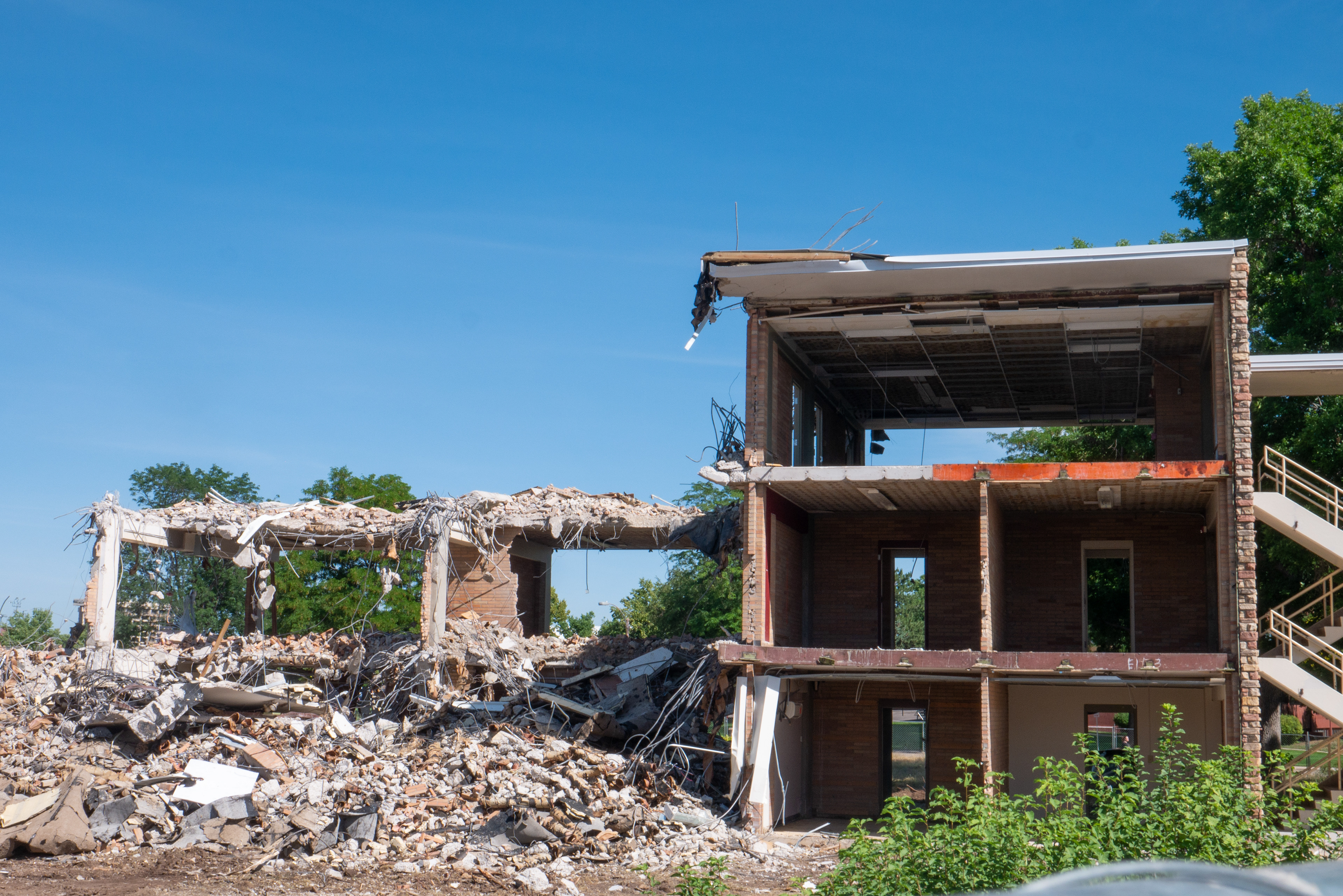 Partial demolition of the NE wing, south-facing side
