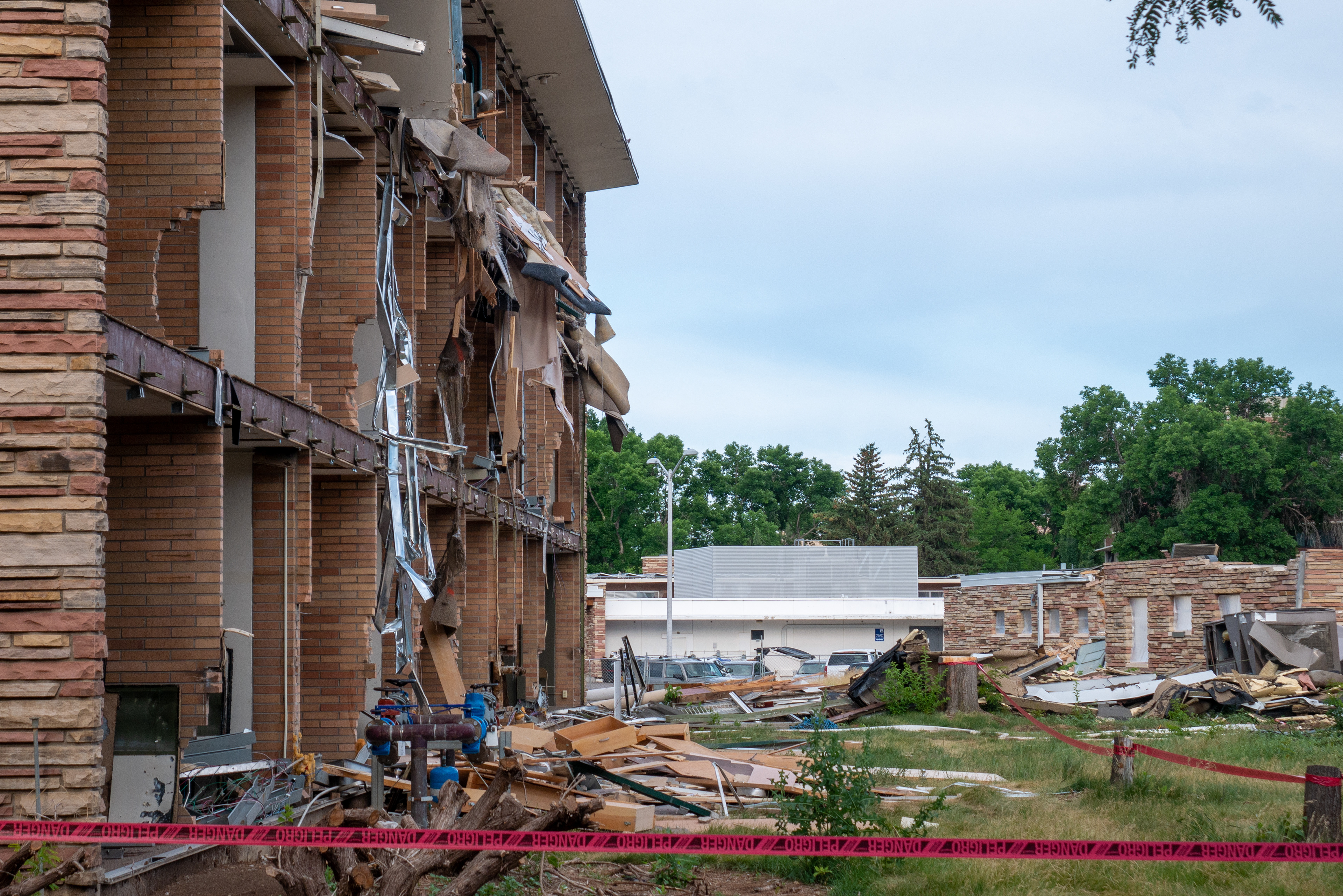 Debris hanging from offices of the NW wing, south-facing side