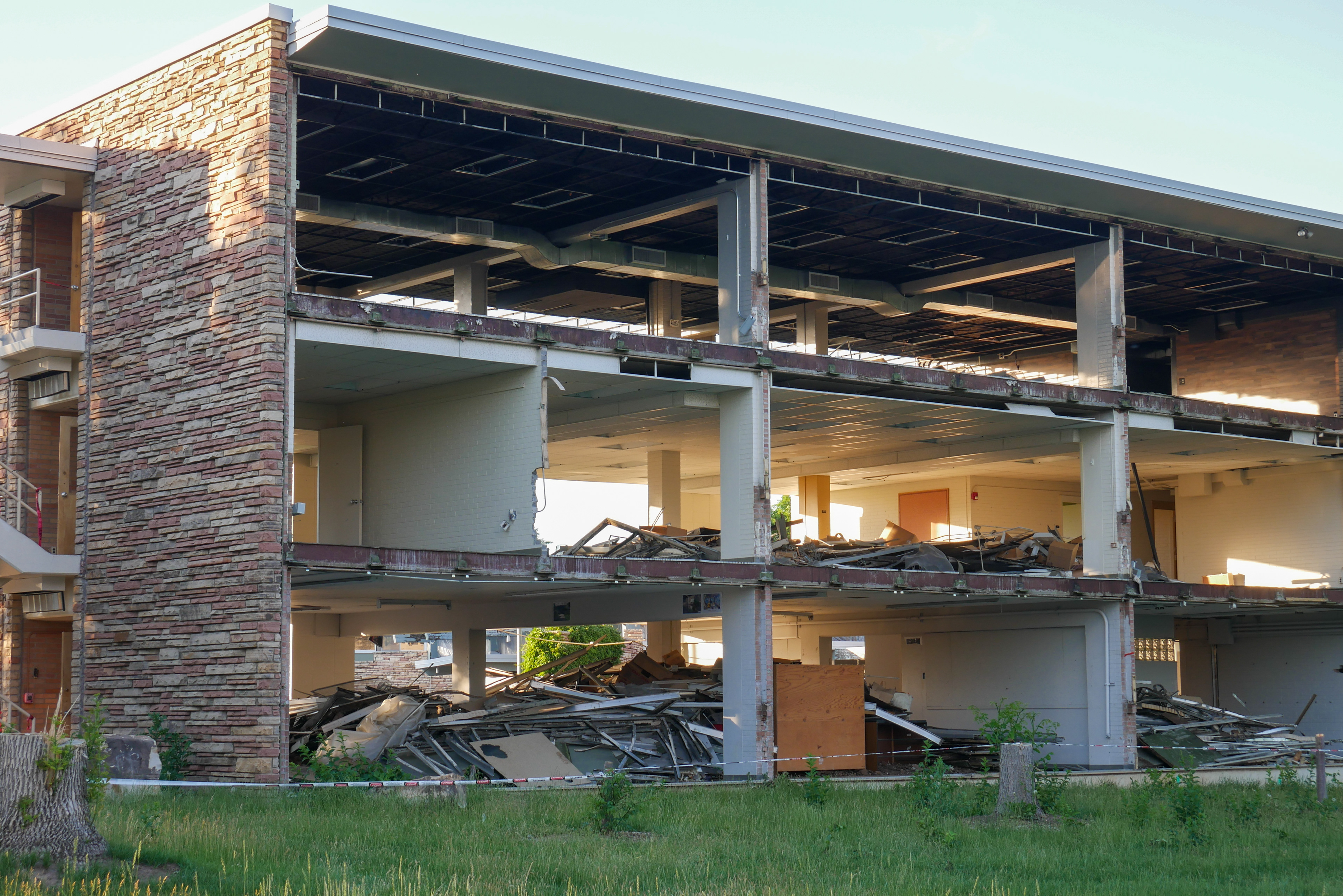 Full removal of windows and sage green panels, south-facing side of the SW wing