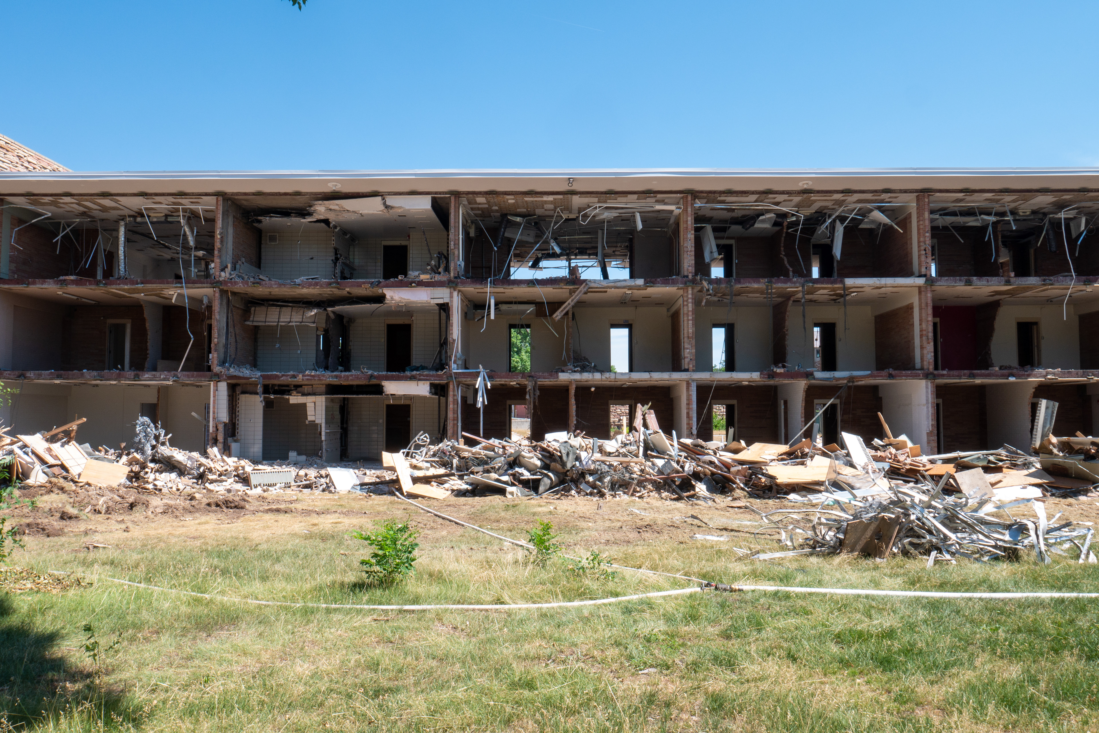 Rubble piled in front of the SE wing, south-facing side