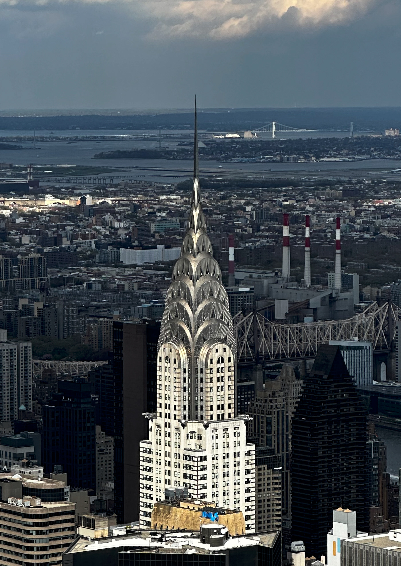 The clouds had been casting a uniform shadow over this view until a beam of sunlight was opened onto the Chrysler Building.
