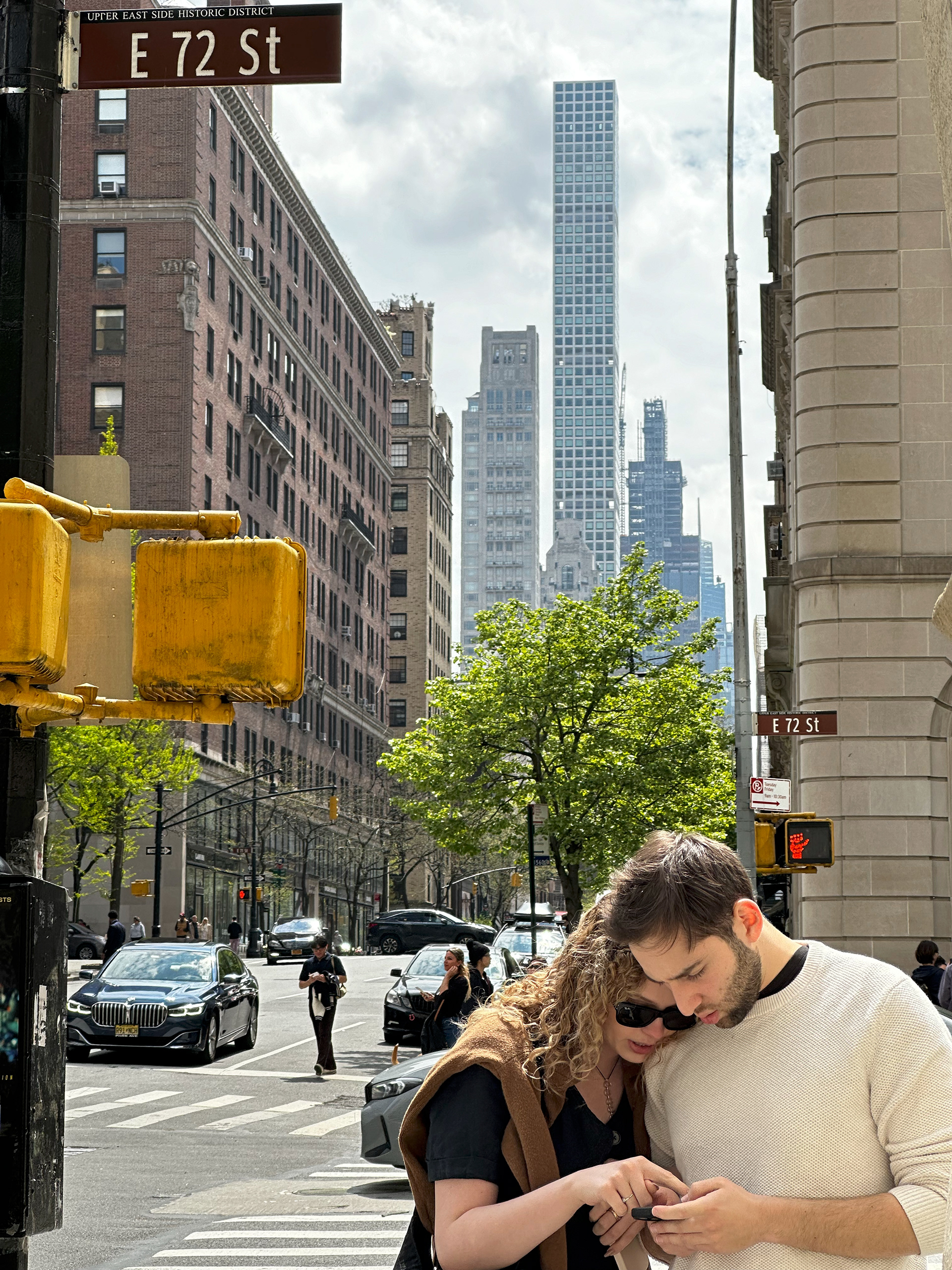 The very tall building in the distance is 432 Park Ave. I stopped to take a photo. But my favorite part is the couple. So sweet.