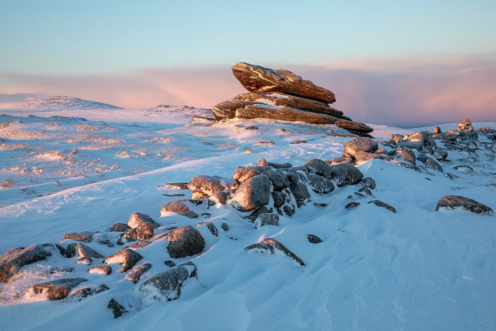A snowy scene at Irishman's wall, Dartmoor, taken just after sunrise