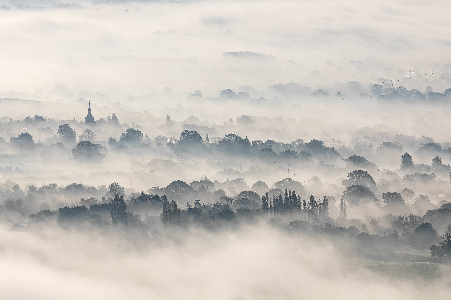 Fog in the village of Castlemorton, Worcestershire, taken from the Malvern Hills