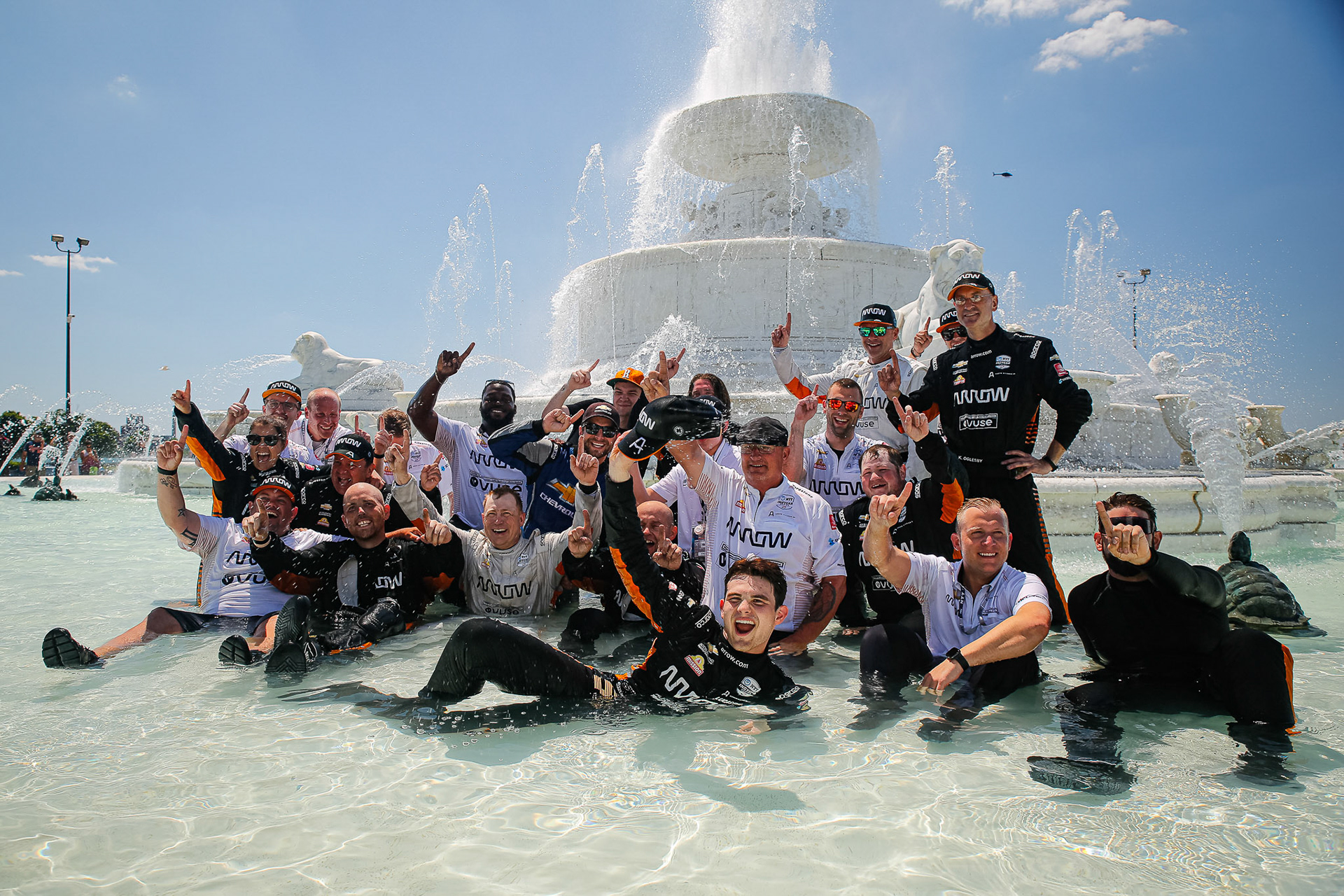 #5: Pato O’Ward, Arrow McLaren SP Chevrolet celebrates winning in the fountain with crew members