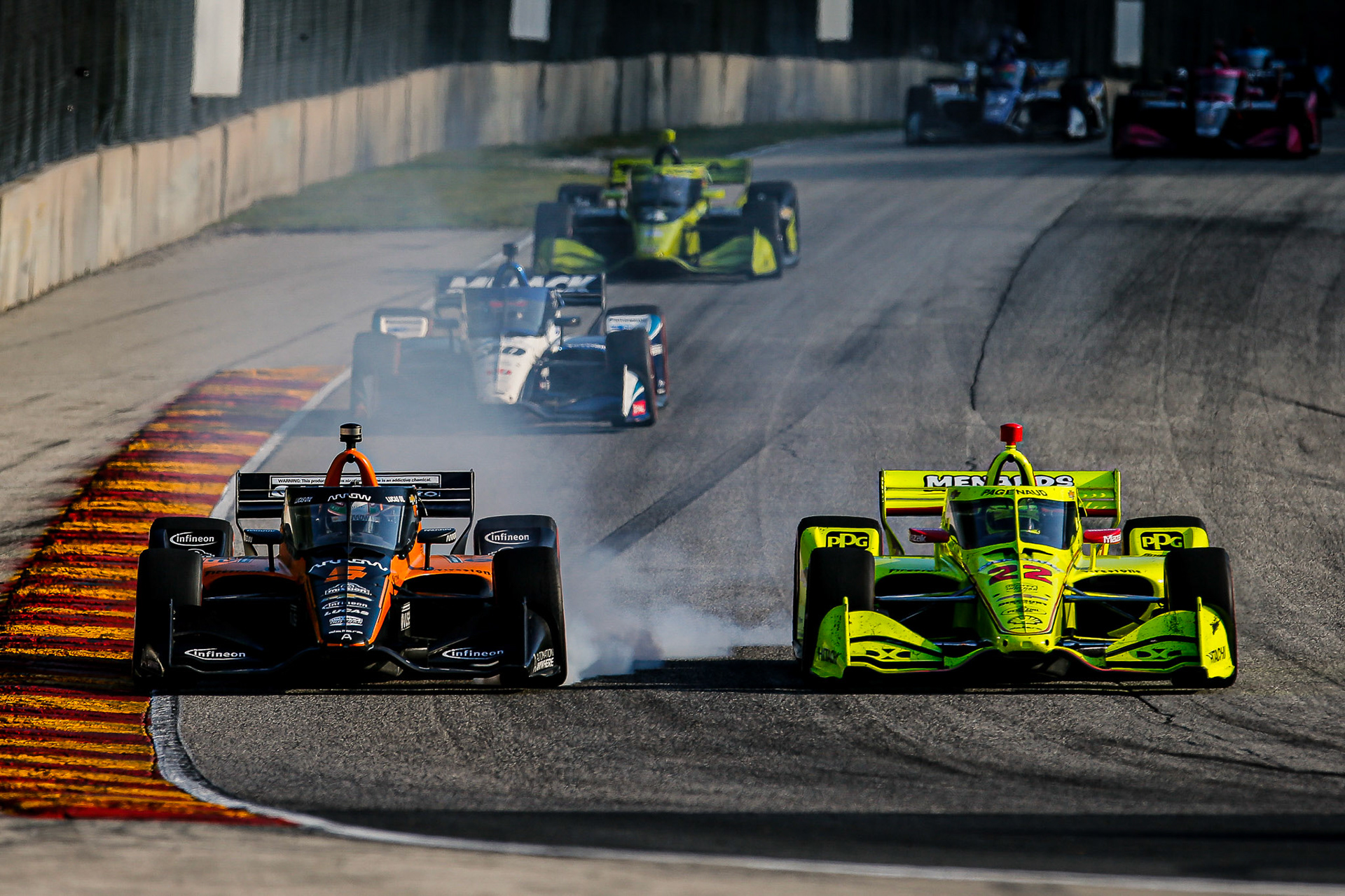 #5: Pato O’Ward, Arrow McLaren SP Chevrolet locks up his brakes, #22: Simon Pagenaud, Team Penske Chevrolet