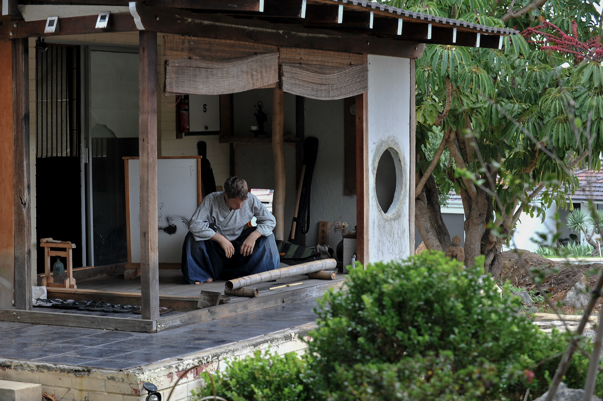 In the back streets of a Fremantle suburb is a Rinzai Zen temple. Converted from a classic 1960's brick and tile house, the Zendo offers meditation, calligraphy, and kobudo. The Kobudo training, particulary in sword, is prominent. Training takes place after a formal Zen meditation session. Here a student prepares for practice.