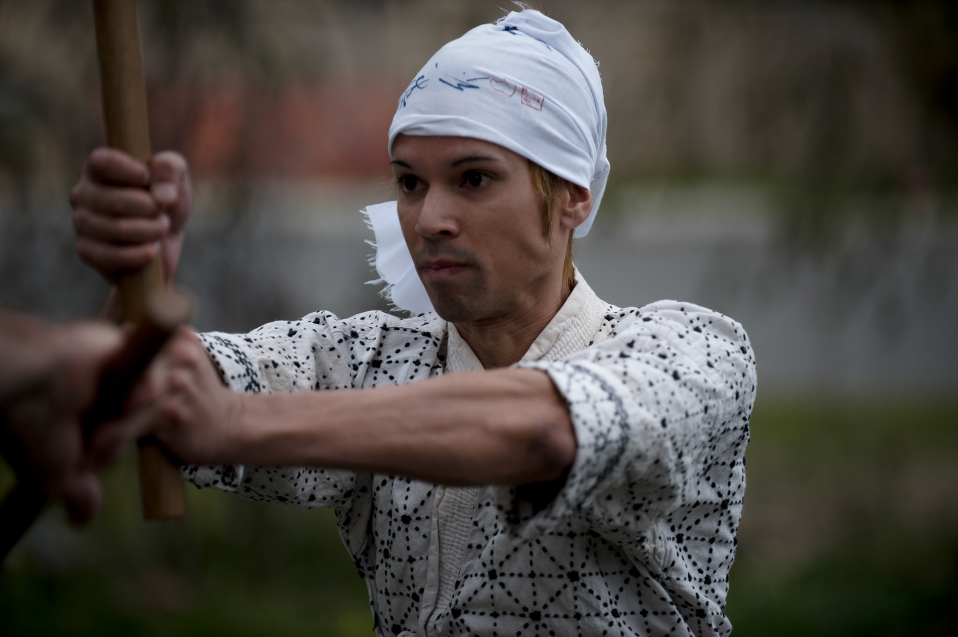 In the back streets of a Fremantle suburb is a Rinzai Zen temple. Converted from a classic 1960's brick and tile house, the Zendo offers meditation, calligraphy, and kobudo. The Kobudo training, particulary in sword, is prominent. Training takes place after a formal Zen meditation session. Here a student trains is a set-piece combat.