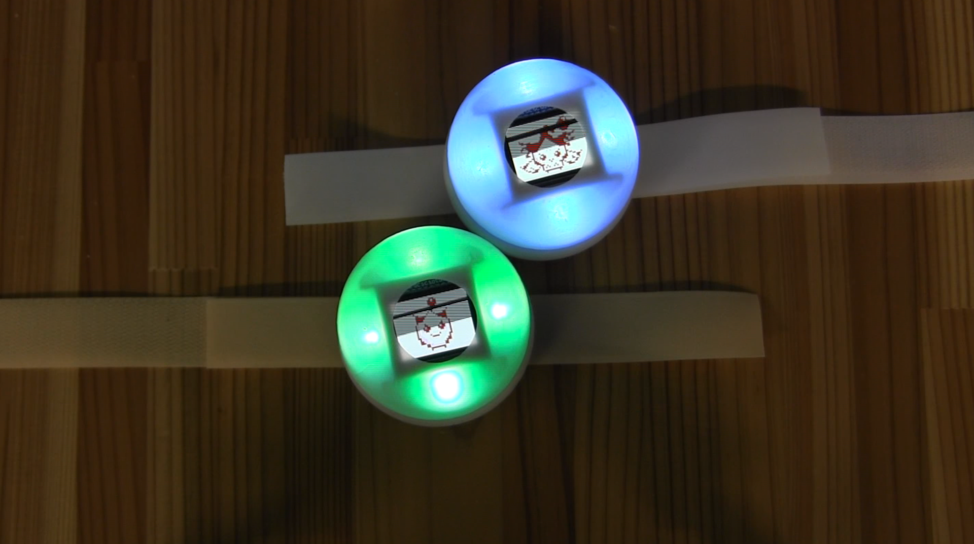 A sleeker, lighter version of the wearable device. This design aims to motivate children to collaborate and help their digital pets grow by forming and maintaining group connections.