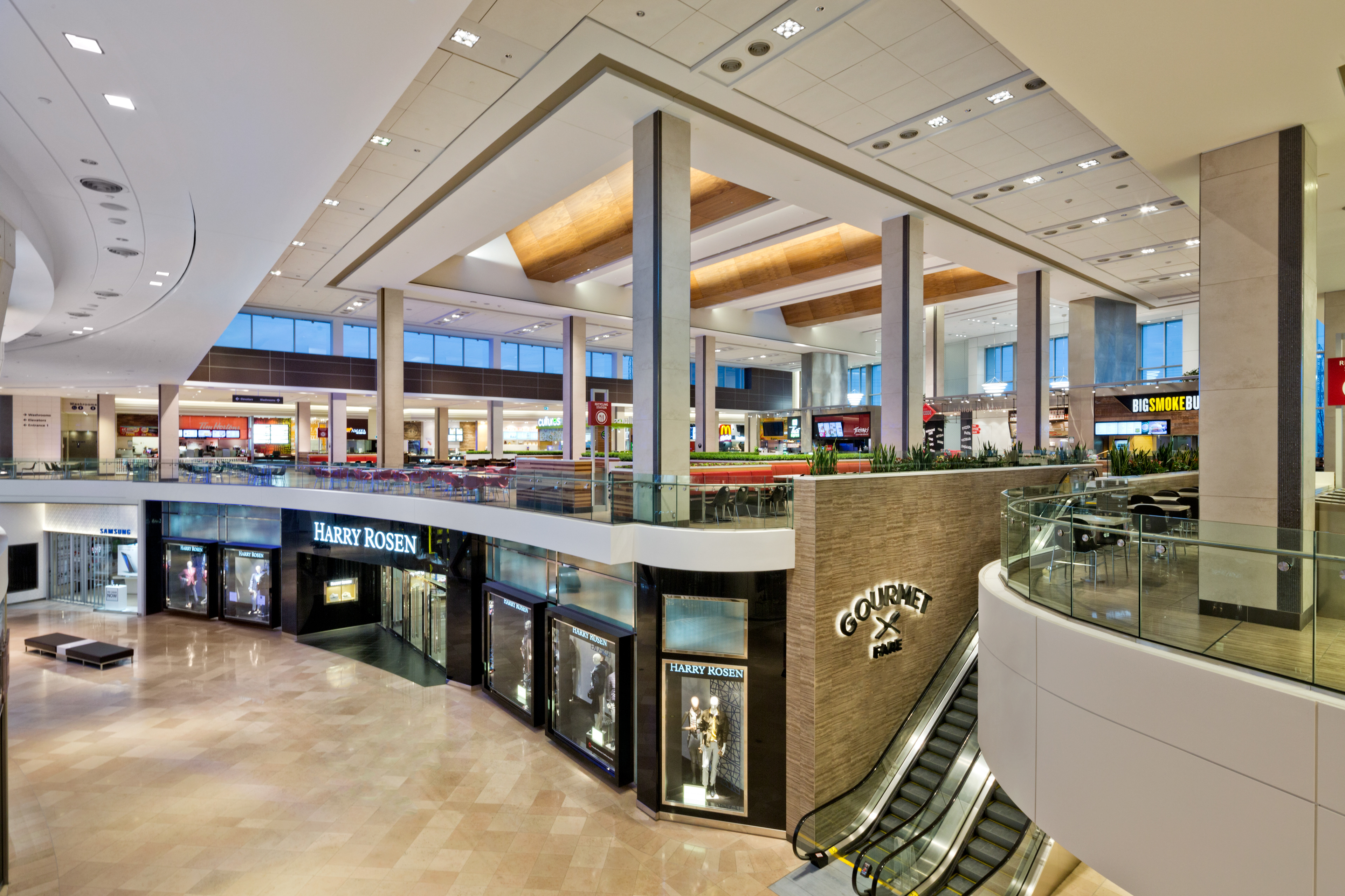 Gourmet Fare dining hall, with new signage at entries and triple-height ceilings, creating an airy dining experience.