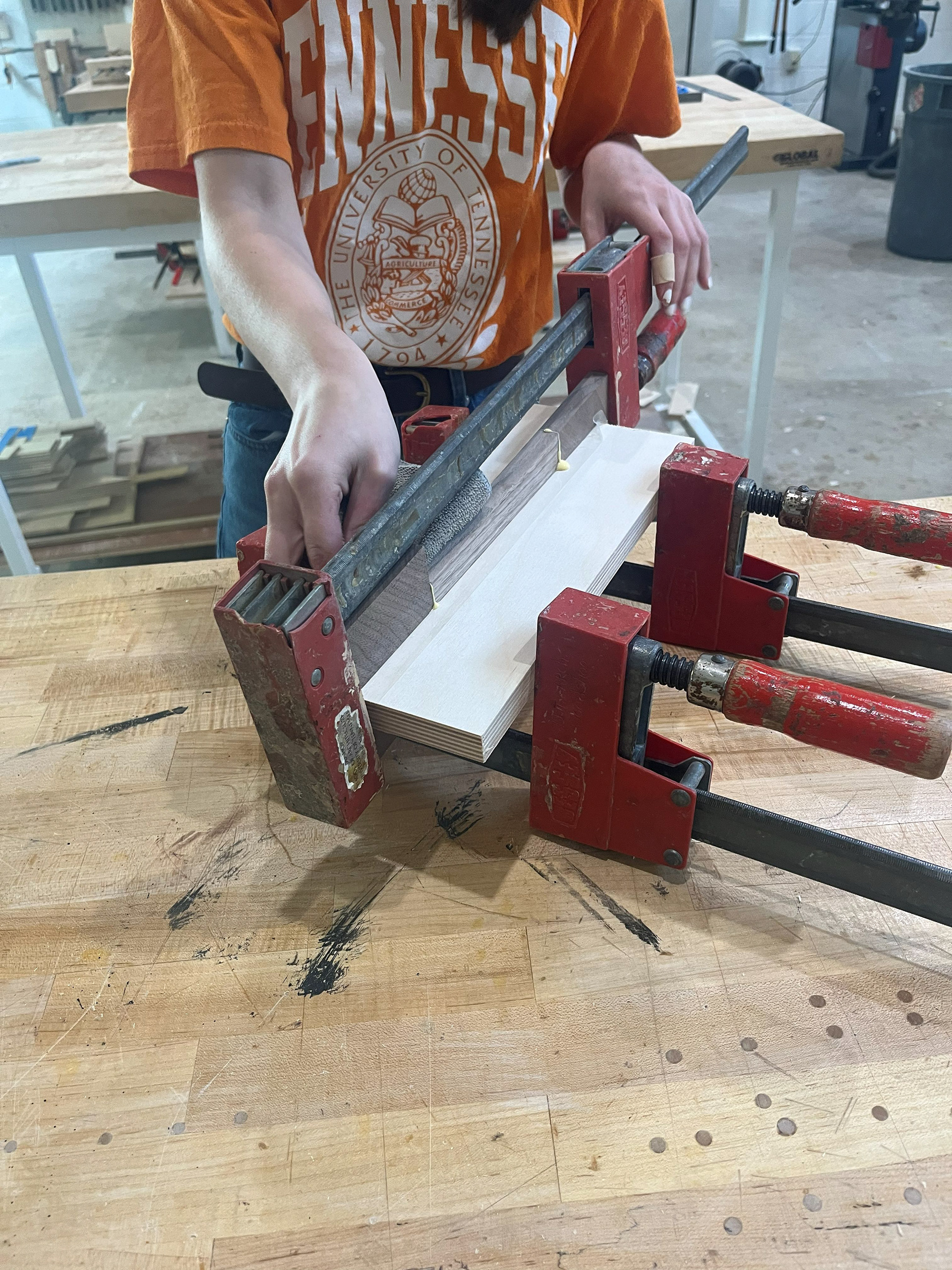 Image 21 | Clapping the Glued S-curve Leg between Two Pieces of Taped Plywood to Help Stabilize the Assembly in the Drying Process
