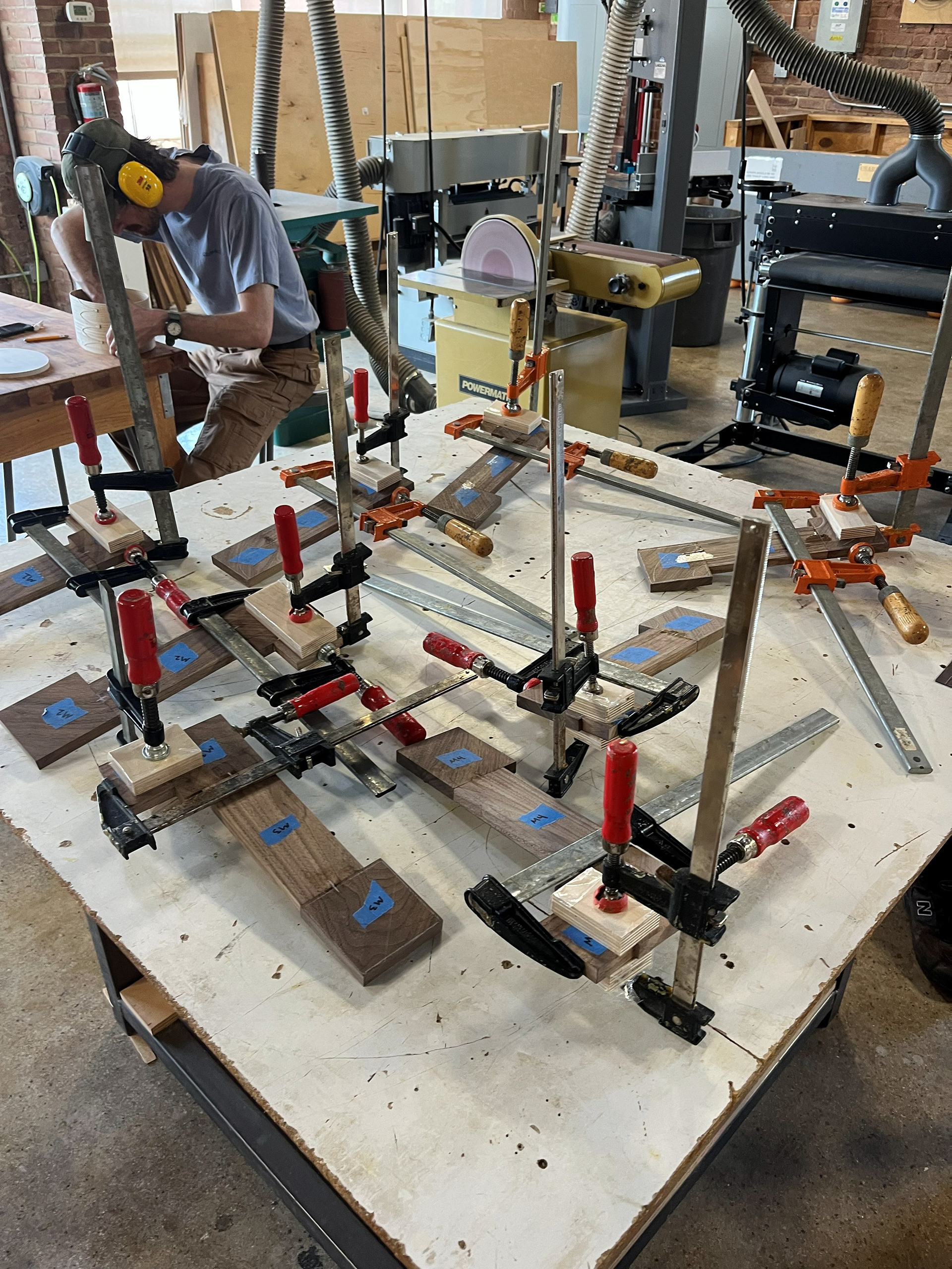 Image 22 | Gluing and Clapping the End Piece of the S-curve Legs after the First Glue-up Finished Drying