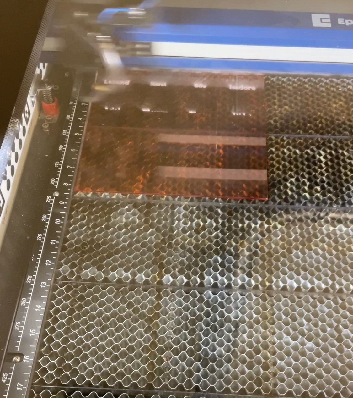 Font tiles in the laser cutter.