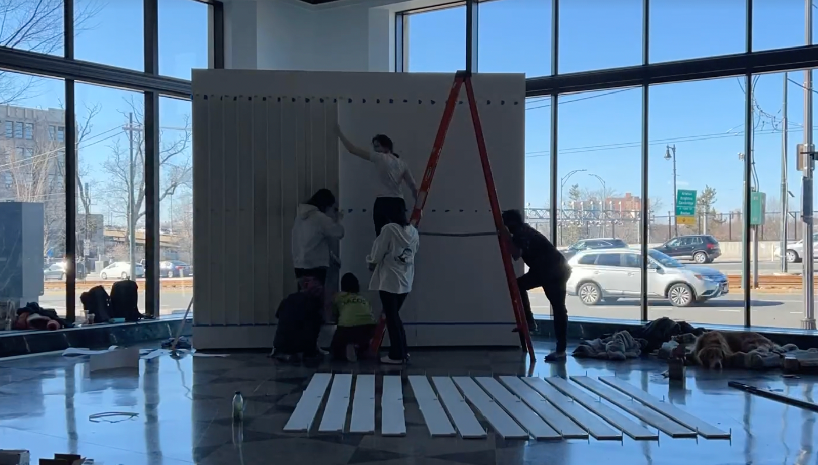 Attaching lenticular panels to wall