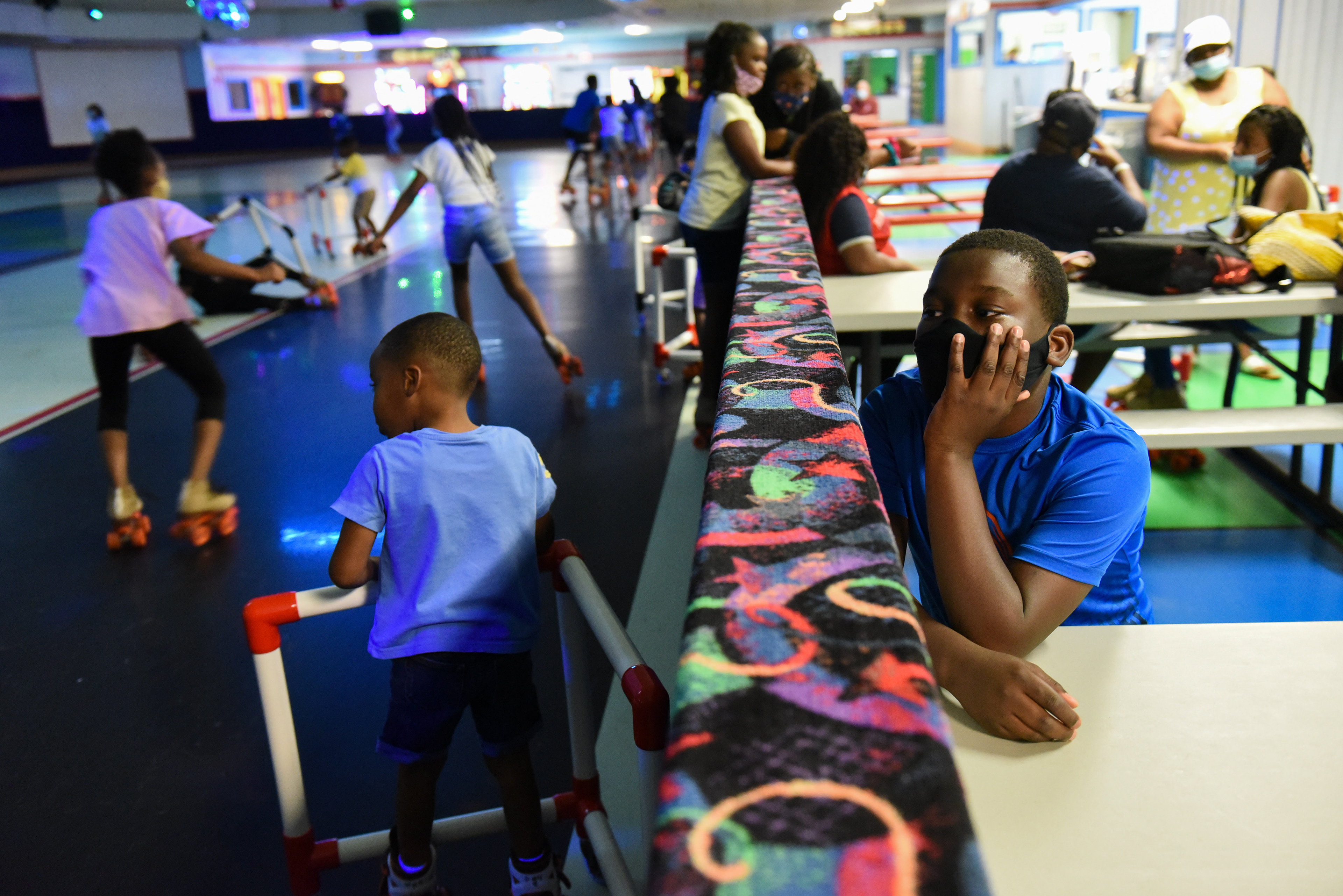 Tomarkus Gray, 12, watches his peers as they skate on July 21 at Skate Odyssey in Starkville. Ms. Smith’s Academic Summer Camp visits the skate park every week for a field trip. Besides doing schoolwork, campers this summer visited with guest speakers from the community, practiced a praise dance and played basketball outside.