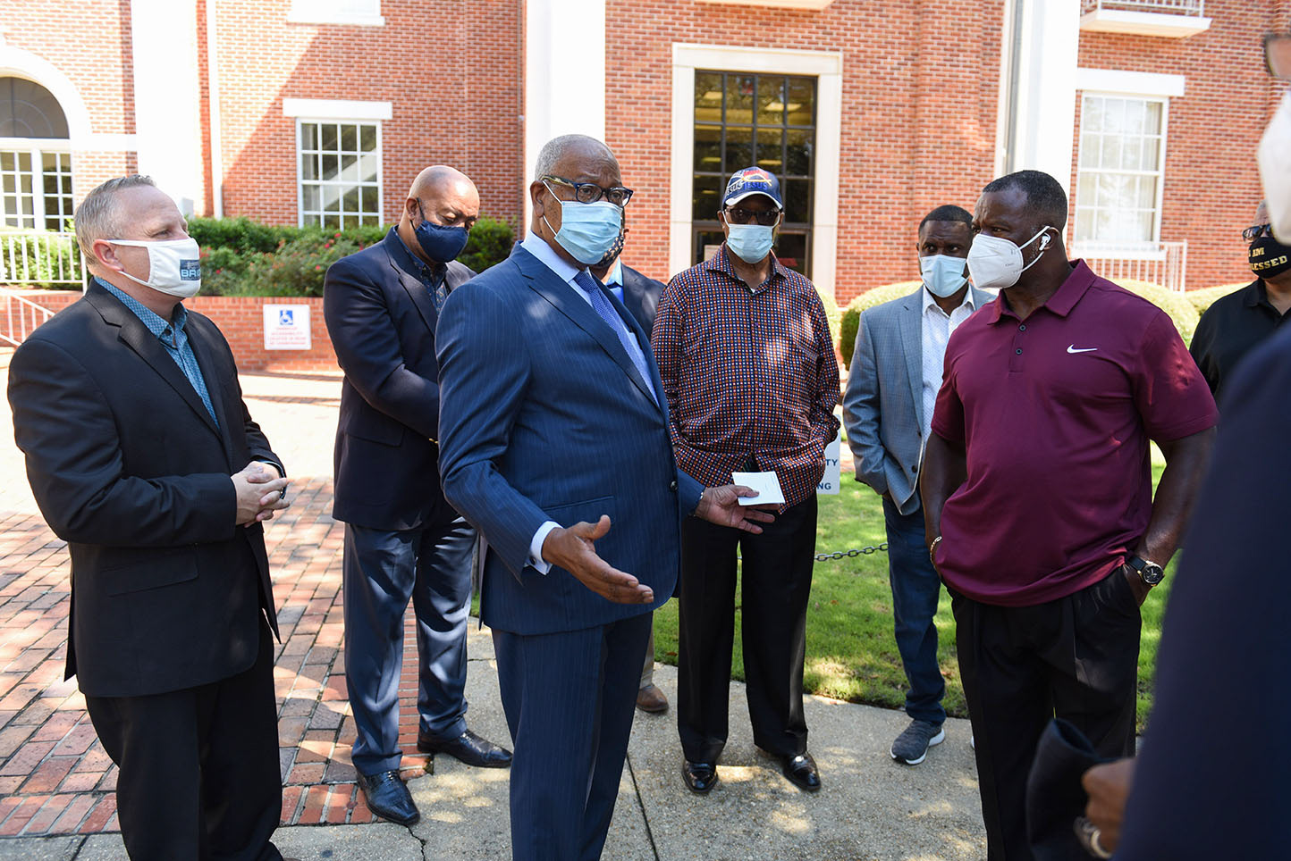 Rev. Ron Houston thanks other community faith leaders for uniting together to demand County Supervisor Harry Sanders’ resignation on Monday, August 3 outside the Lowndes County Courthouse in Columbus. Houston spoke during the meeting while others stood behind him to show support.