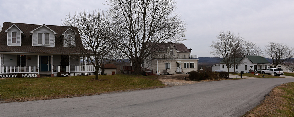 Houses owned by three generations of the Wehrle family sit in a row Sunday, December 8, 2019 in Rhineland, Missouri. The home on the left belongs to Steve and Janet Wehrle. The home in the middle belongs to Janet’s mother, Margaret Bahr. The home on the right belongs to Steve and Janet’s son Scott Wehlre, his wife Amanda Wehrle, and their two children Machaela, 15, and Tate, 10. All three homes were relocated to these lots when the town moved uphill in 1993.