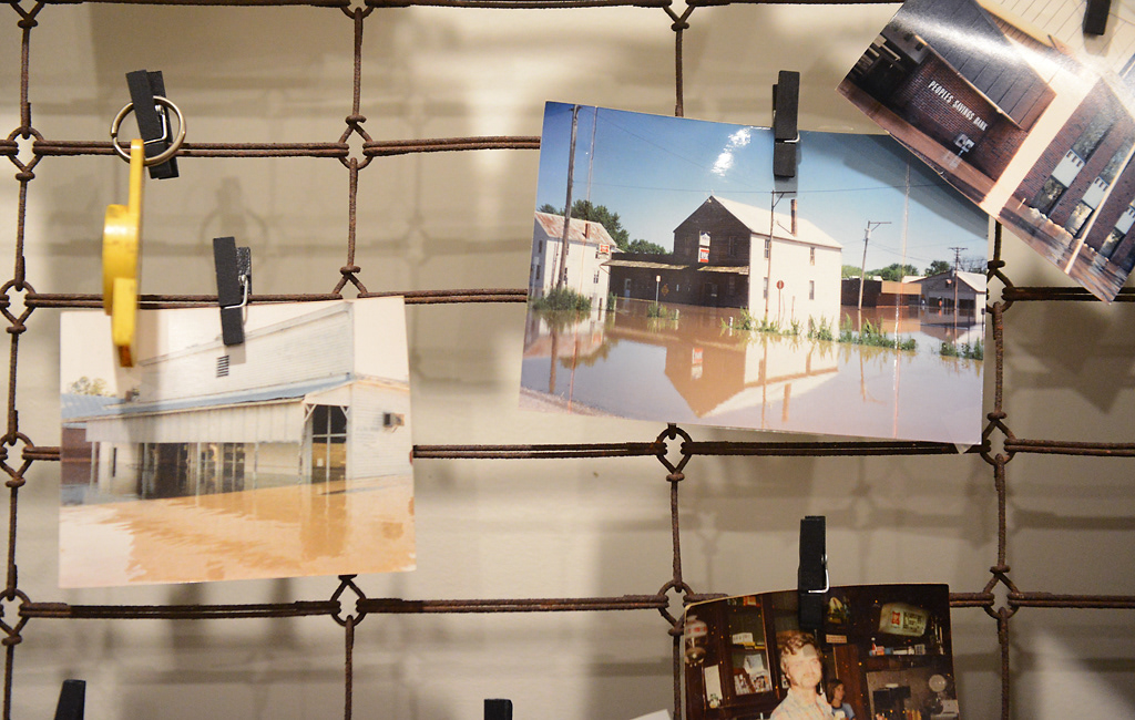 Photos of town during the 1993 flood decorate the walls of The Corner Friday, November 15, 2019 in Rhineland, Missouri. The building in the middle photo is where The Corner used to be located.