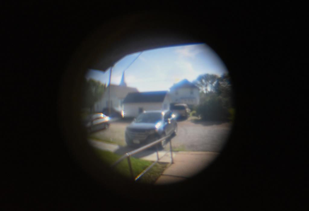 The town of Concordia, as seen through the peephole on the back door of the Western Missouri Family Healthcare clinic on Tuesday, April 28, 2020 in Concordia. The clinic is located on Concordia’s Main Street and is a two-minute drive from Sarah Kirchhoff’s home. “In a small town, you just really get to know your patients on a more personal level,” Kirchhoff said. Kirchhoff said one of the funniest parts of practicing medicine in a rural area is seeing patients around town and having people come up to her and ask for medication refills or for medical advice.