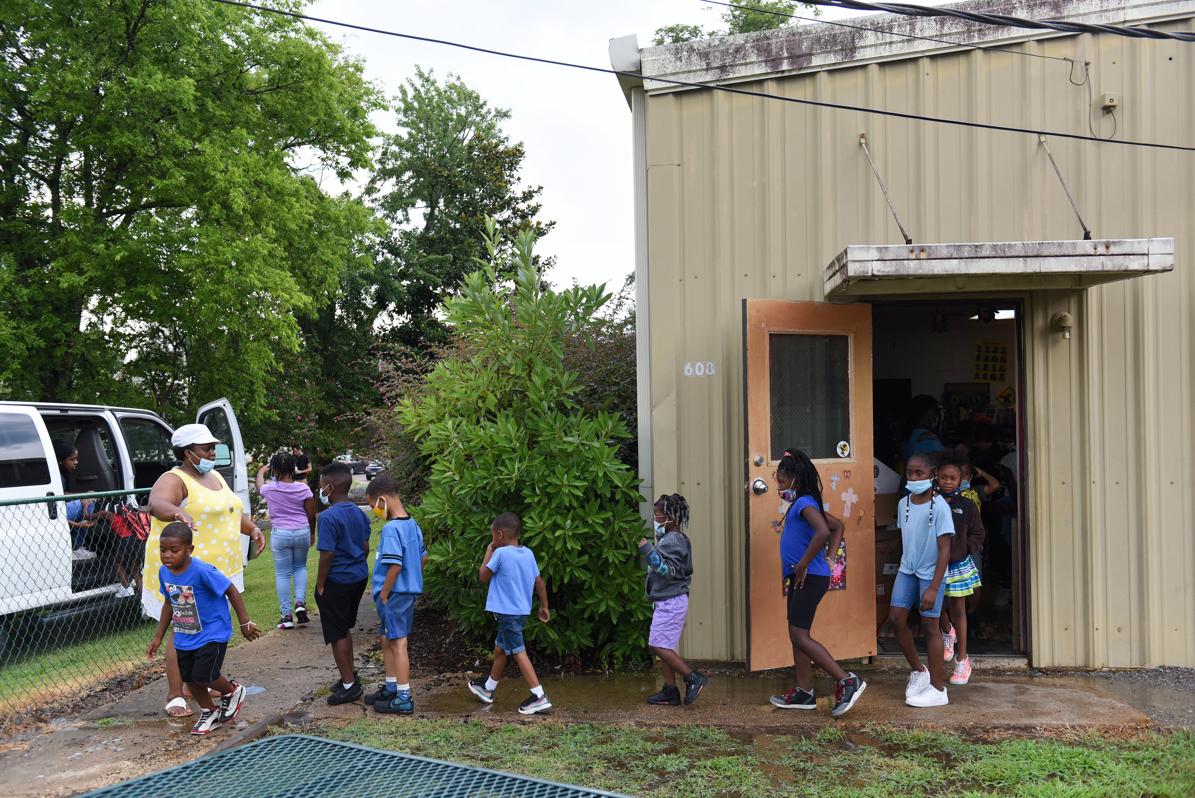 Niya Smith directs kids to the vans before the group went to the skate park on July 21 outside the Needmore Center in Starkville. In previous summers, before COVID-19, campers at Ms. Smith’s Academic Summer Camp would take field trips three times a week and wear a coordinated color so they could keep track of everyone. The camp cut back on field trips amid the pandemic, only taking trips to the skate park, but still encouraged the kids to wear specific colors on each day of the week.