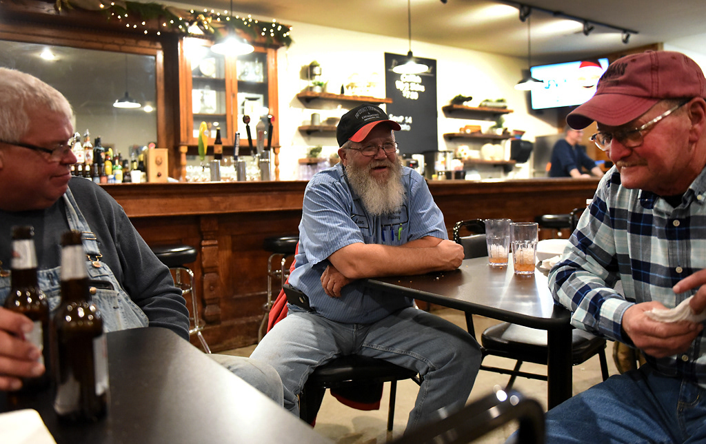 From left, Donny Hagedorn, Leon Englert and Steve Wehrle sit and catch up on a Friday night at The Corner on Friday, December 6, 2019 in Rhineland, Missouri. Before everyone had cell phones, The Corner was Rhineland’s main information hub. “If you wanted to know something you’d come there and somebody knew what was going on,” Wehrle said of those days.